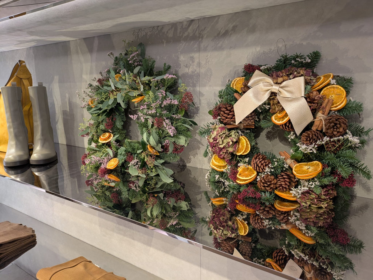 the final christmas wreaths made at a corporate wreath making workshop in london