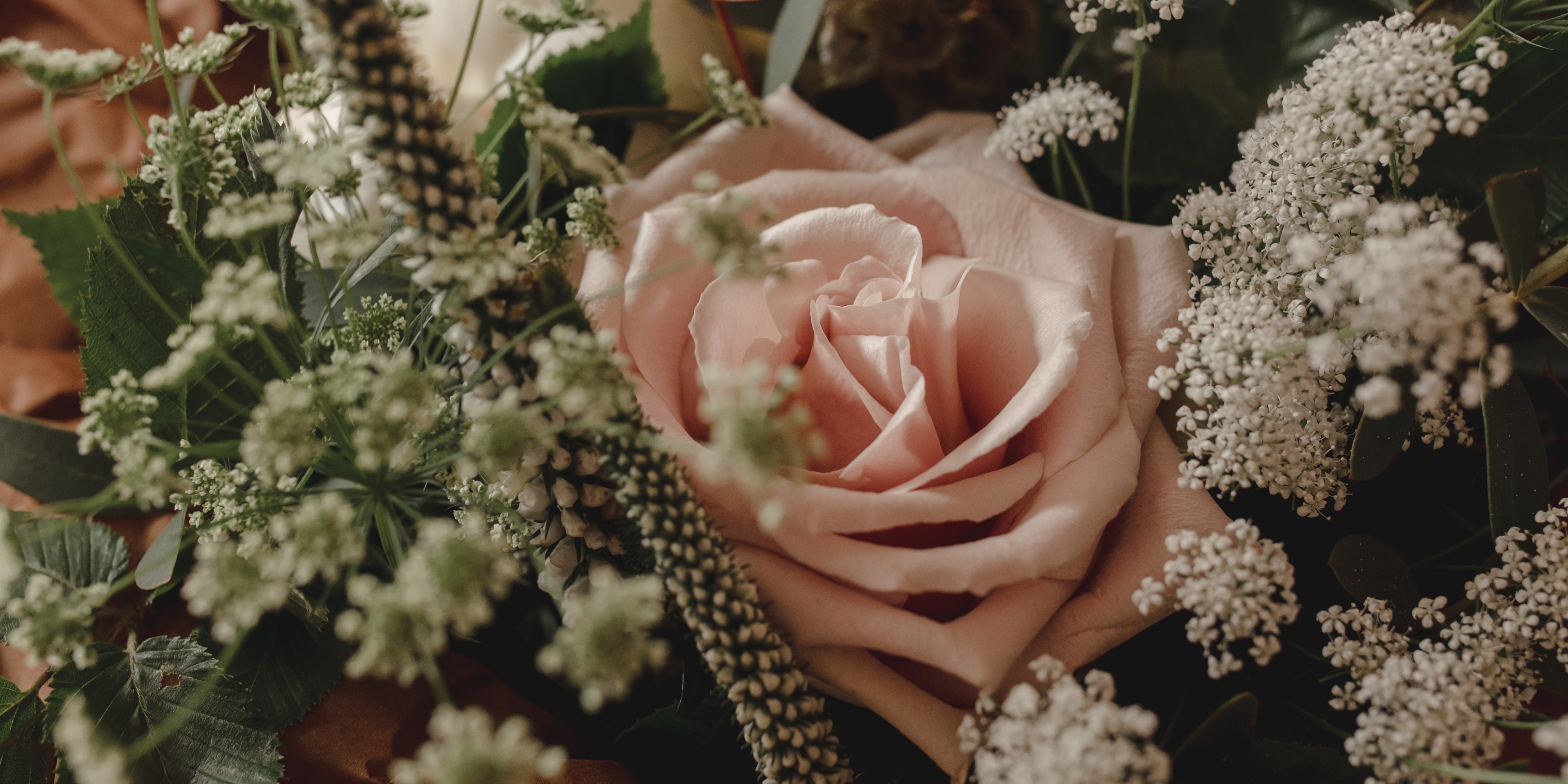 dusty pink roses and seasonal flowers for english countryside garden style bridal bouquet
