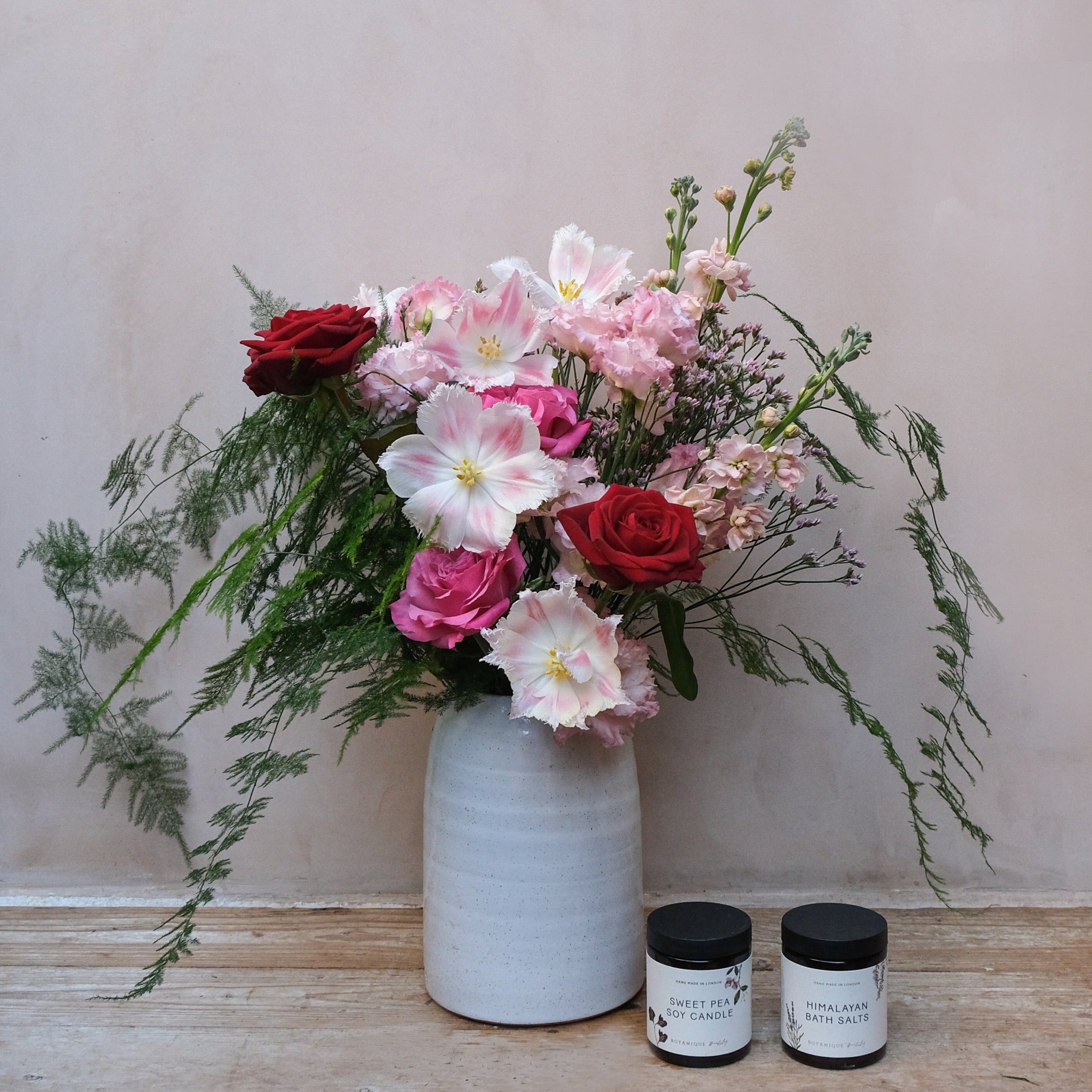 Valentine's Day gift set with red pink roses bouquet candle and jar of bath salts