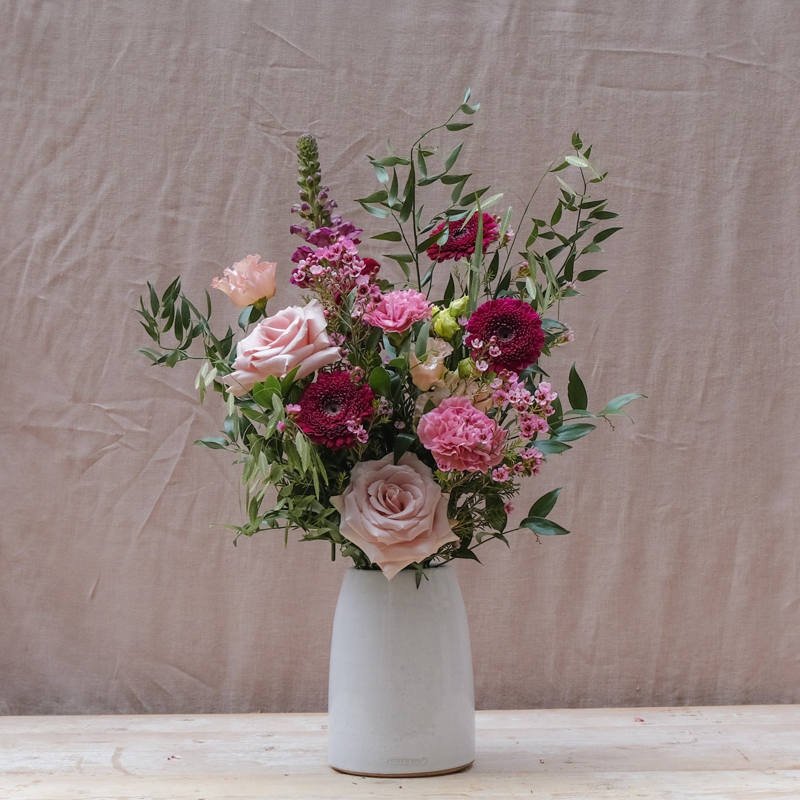 burgundy and pink flower bouquet gift set with fig and rosemary candle and himalayan bath salts