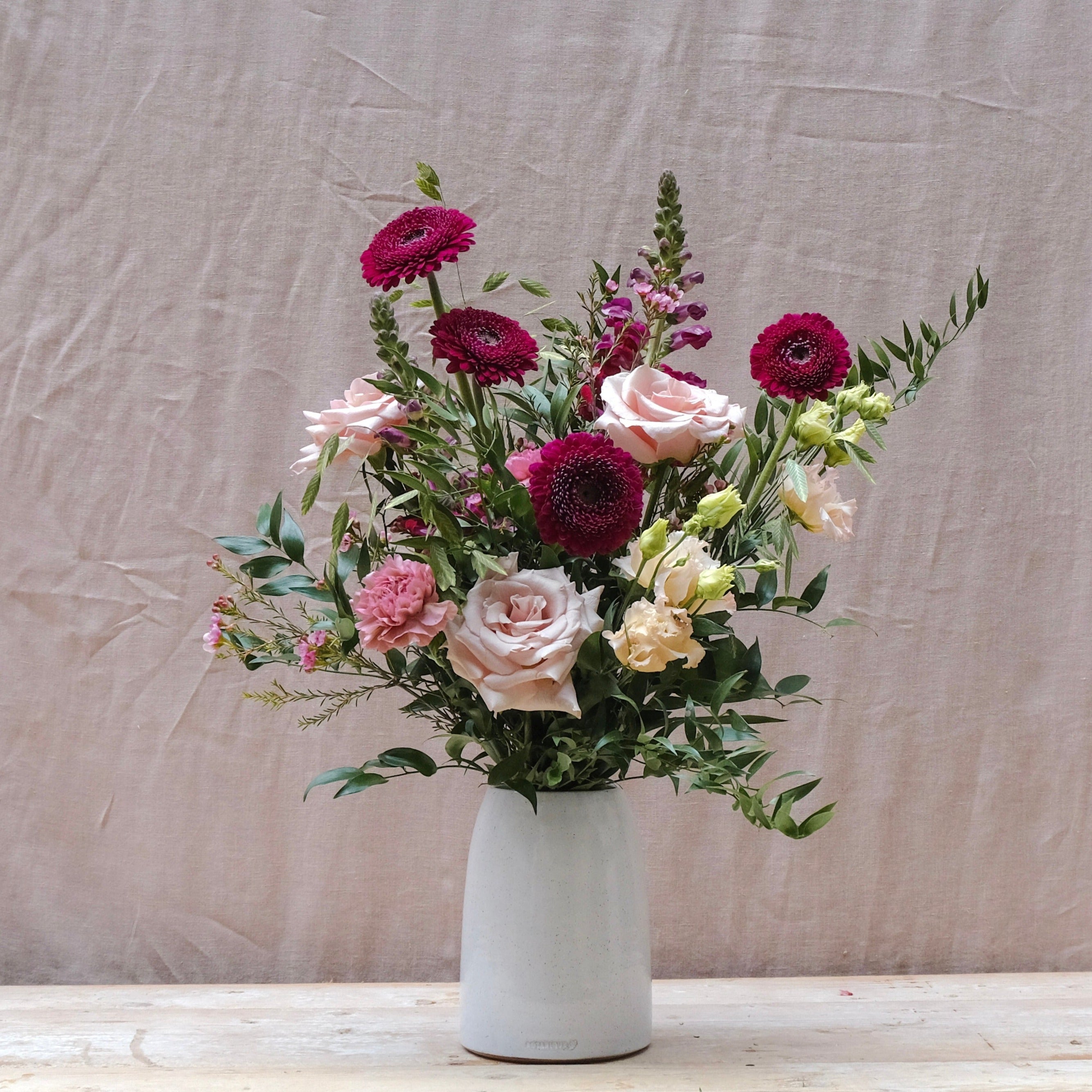 burgundy and pink flower bouquet gift set with fig and rosemary candle and himalayan bath salts