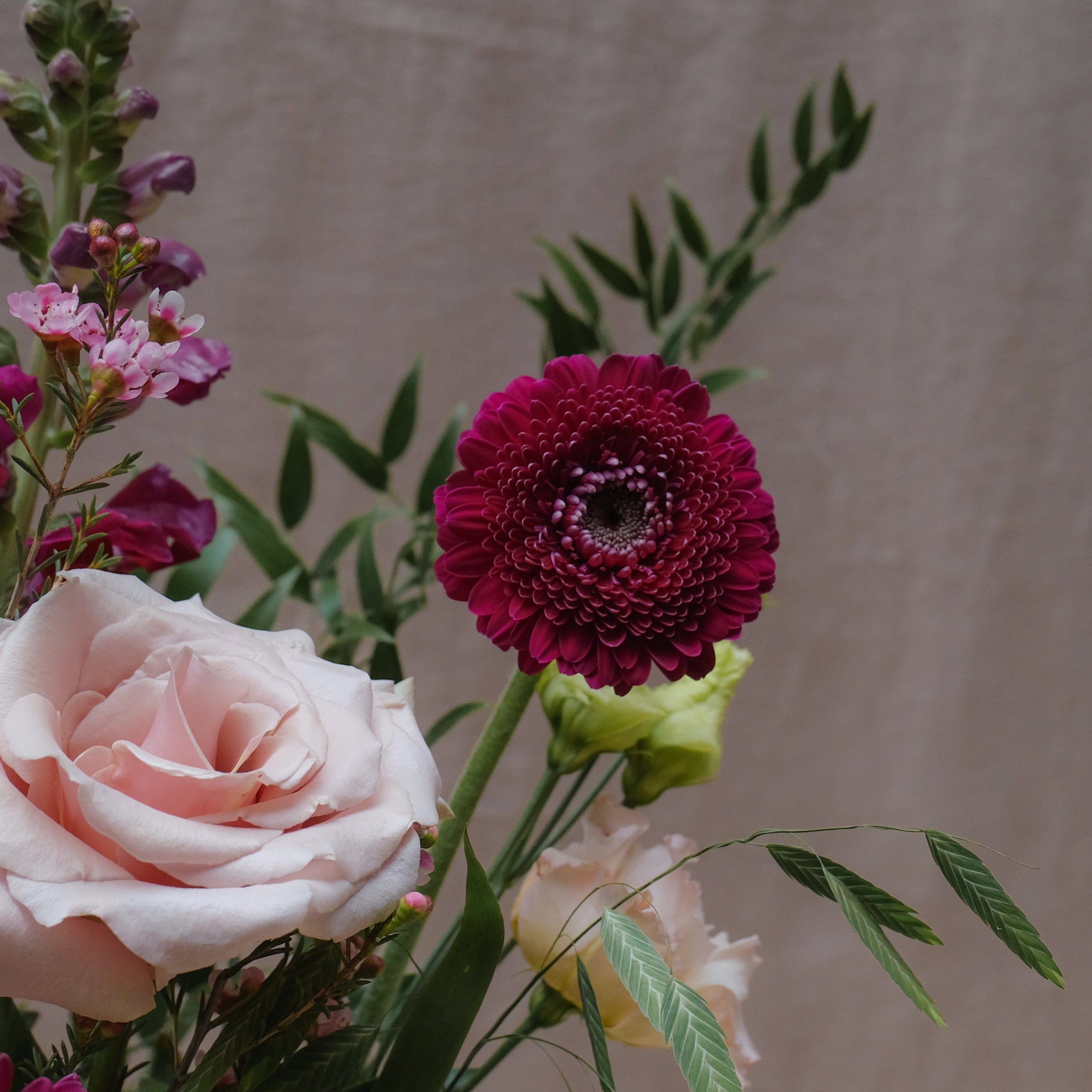 romantic bouquet with burgundy and pink flowers