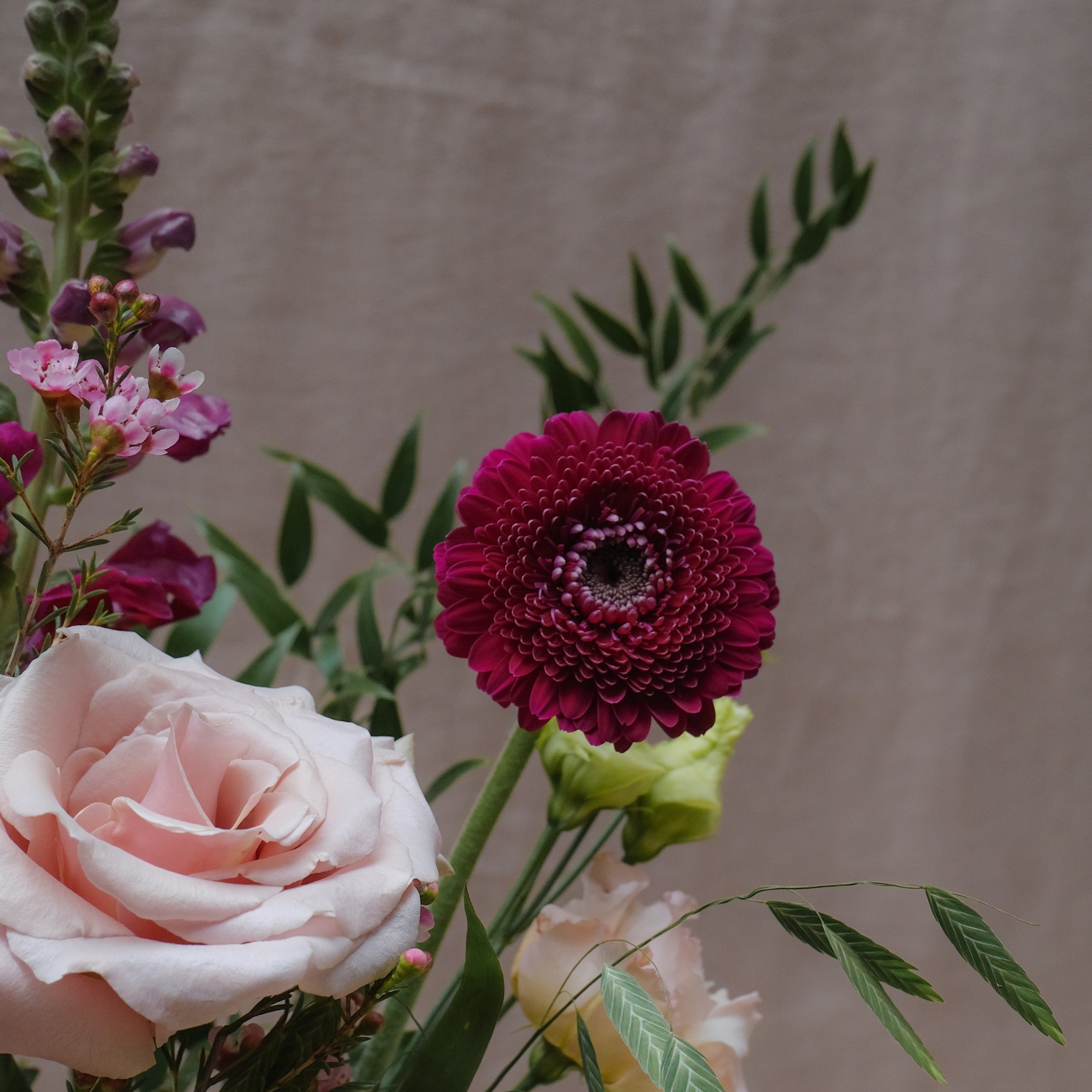 burgundy and pink flower bouquet gift set with fig and rosemary candle and himalayan bath salts