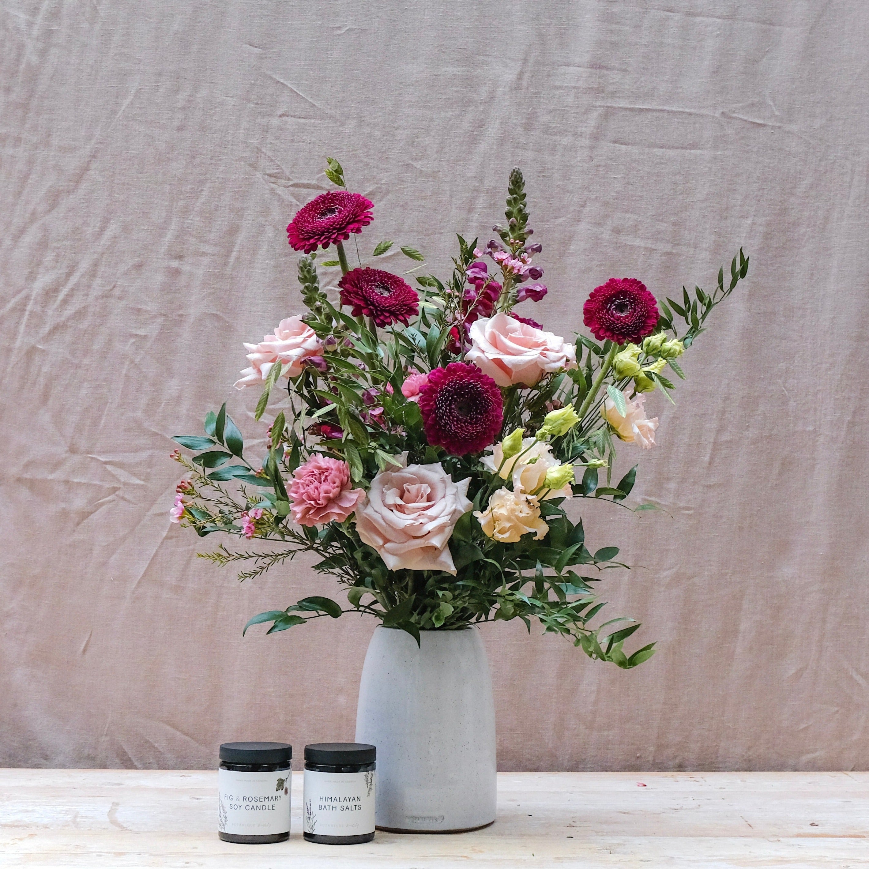 burgundy and pink flower bouquet gift set with fig and rosemary candle and himalayan bath salts