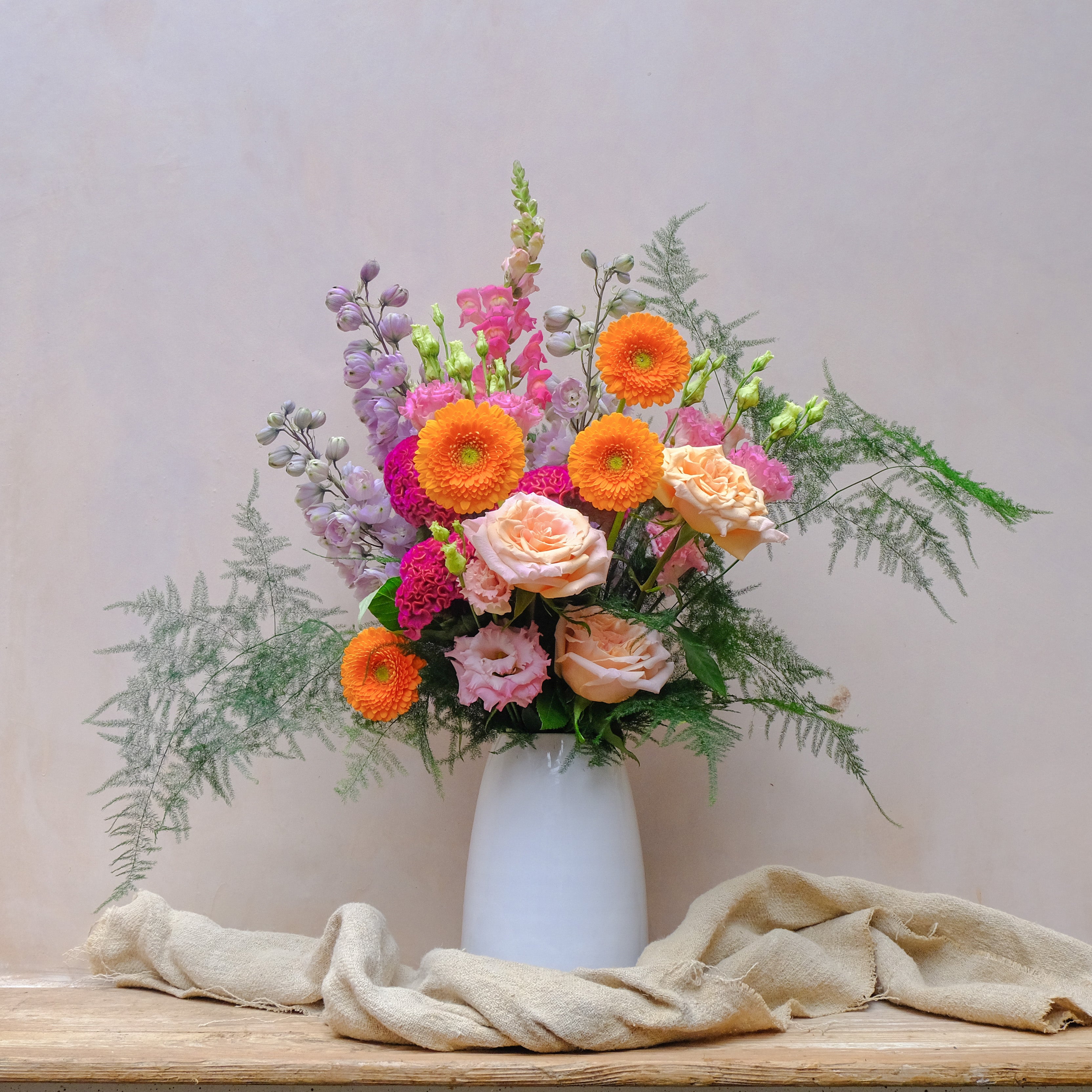 colourful fresh flowers bouquet in white ceramic vase