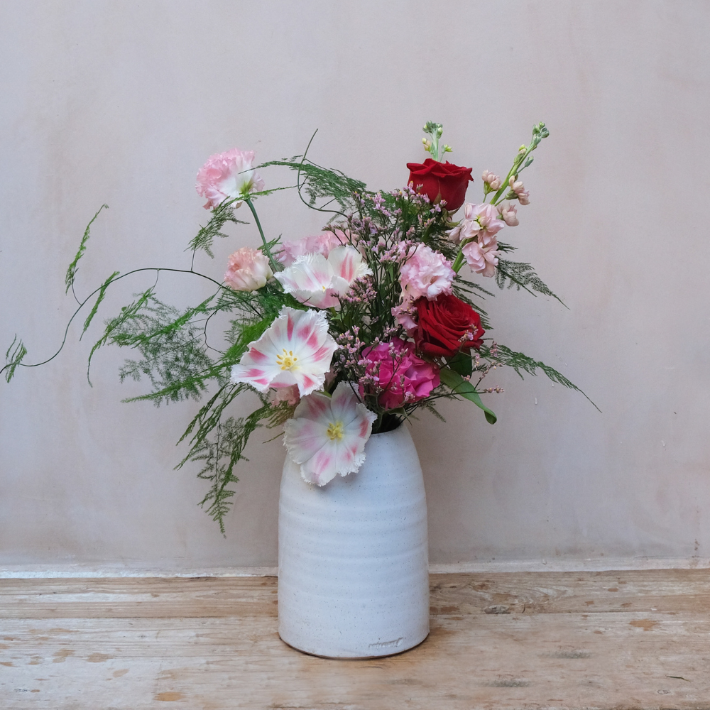 Valentine's Day gift set with red pink roses bouquet candle and jar of bath salts