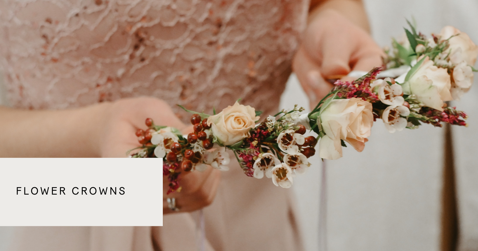 A lady holding a flower crown, made at Botaniques flower crown workshop in london