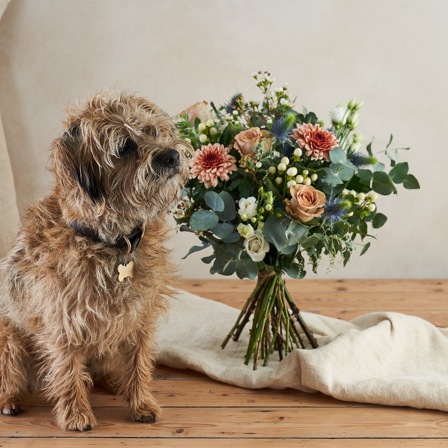 muted tones fresh flower bouquet with eucalyptus roses and thistle