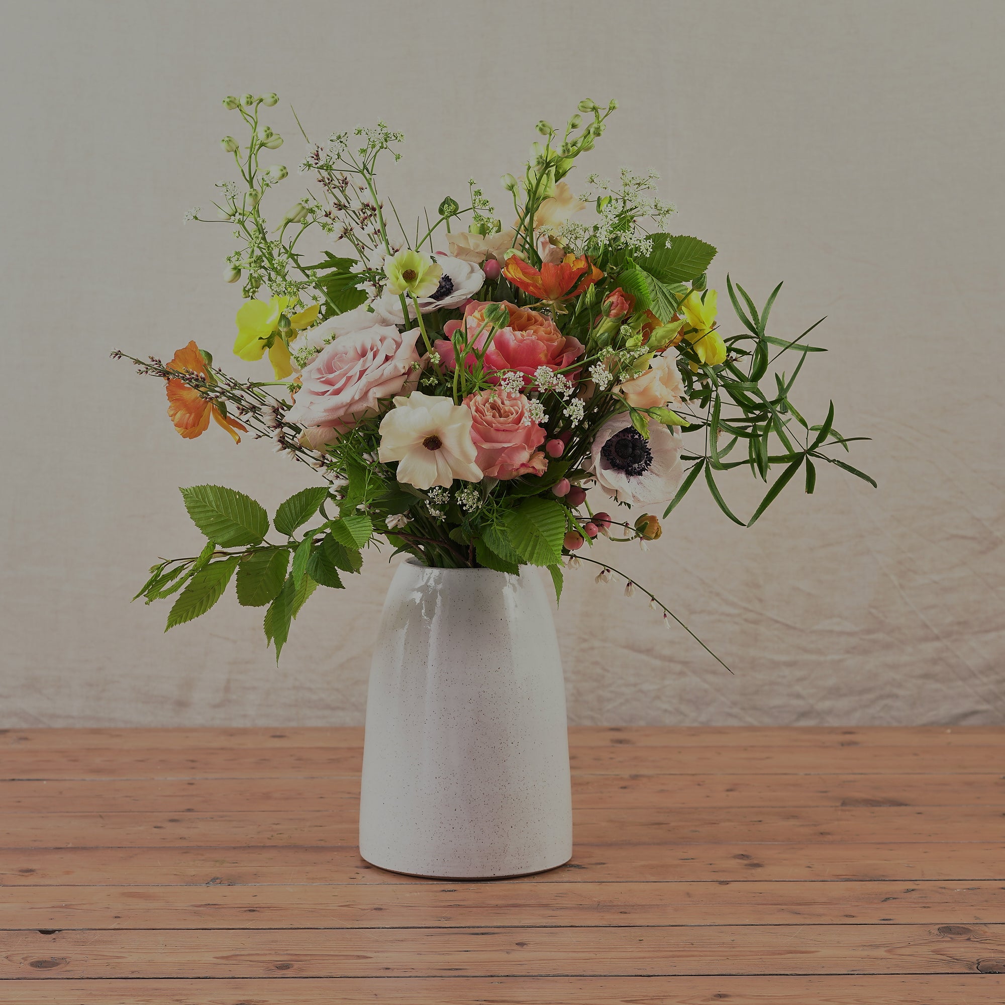 white hand thrown ceramic vase with speckled finish