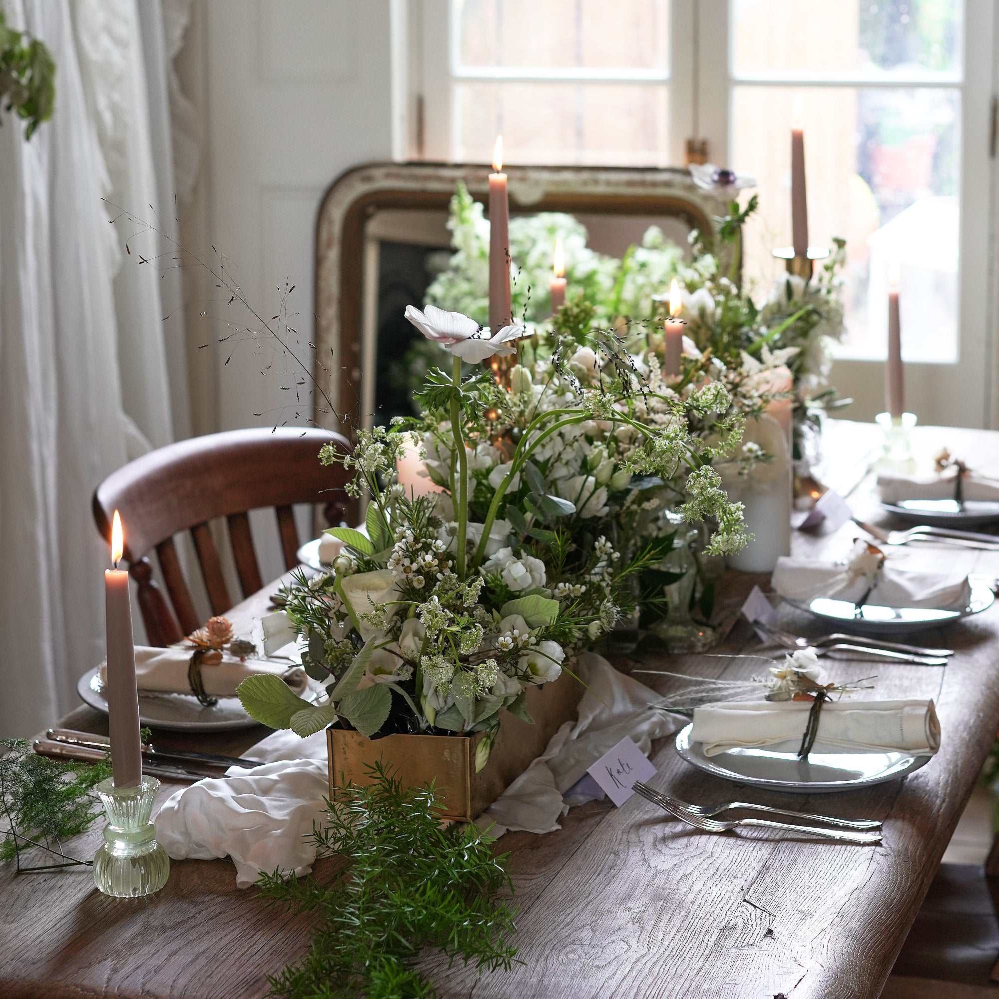 classic white wedding flowers through arrangement to decorate wedding venue by Botanique Workshop
