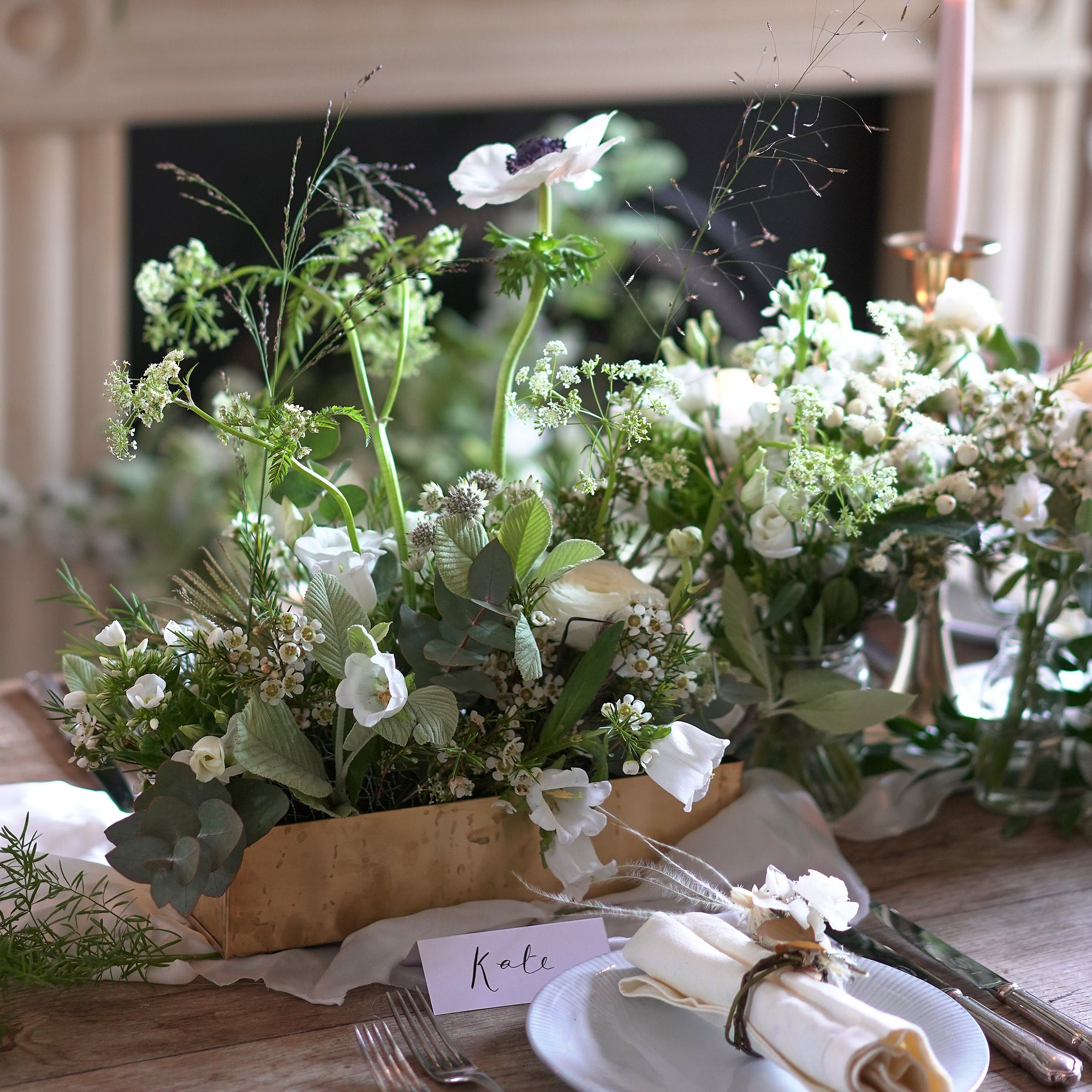 classic white wedding flowers through arrangement to decorate wedding venue by Botanique Workshop