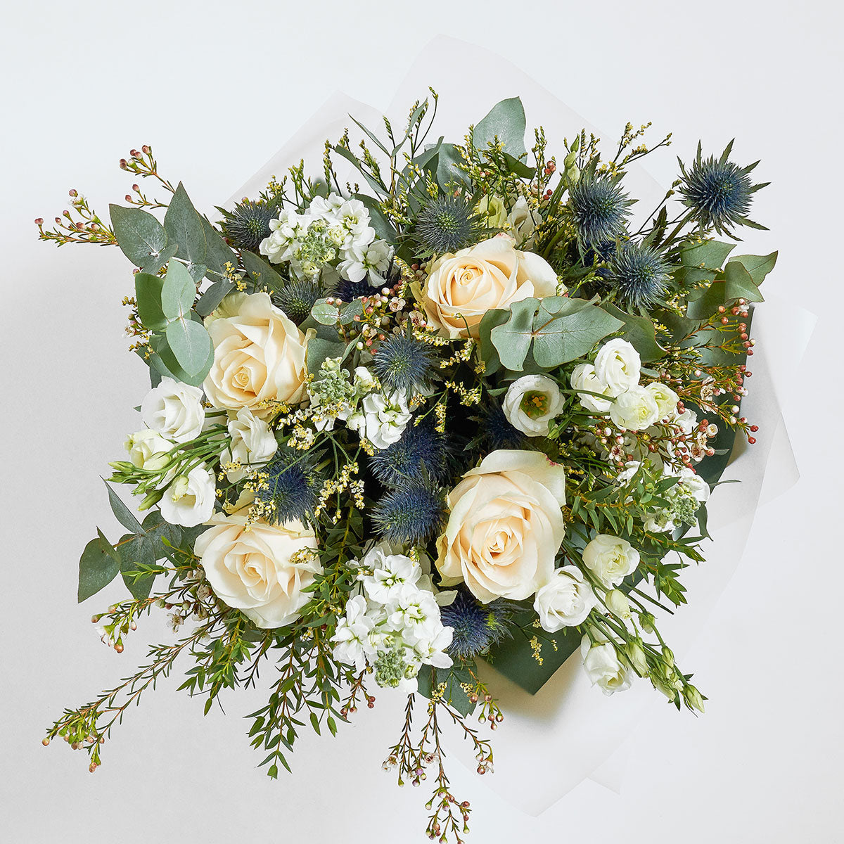 classic white bouquet with white roses and eucalyptus for delivery in London and UK Nationwide