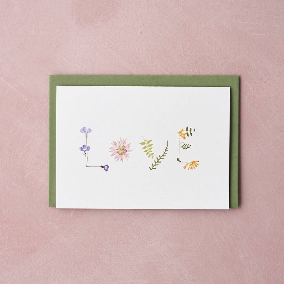"love" pressed flower design card by Botanique Workshop