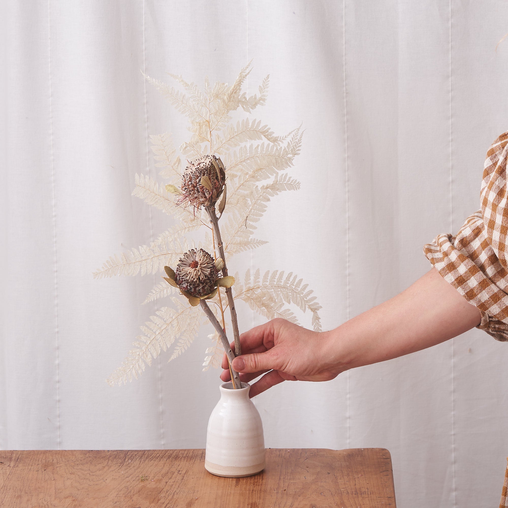 dried flower bunch with bleached white fern and banksia