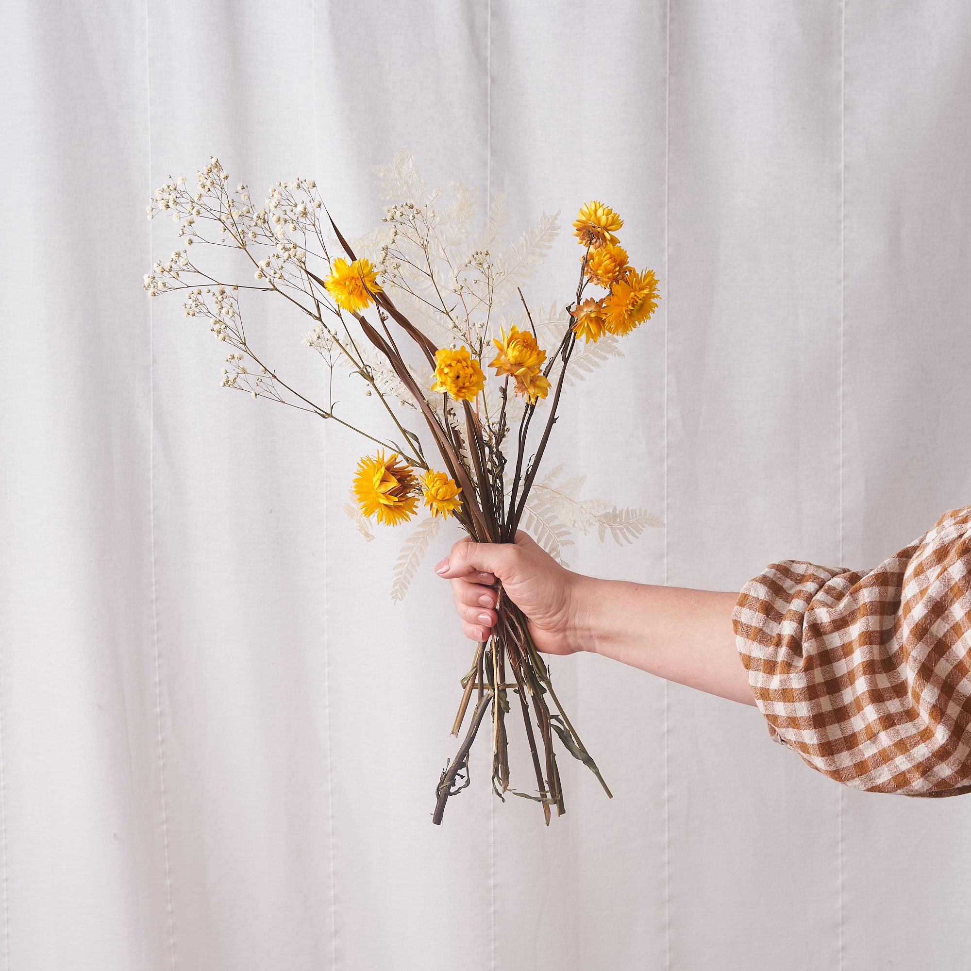 Sun Beam: bleached fern, white gyp and yellow straw flower