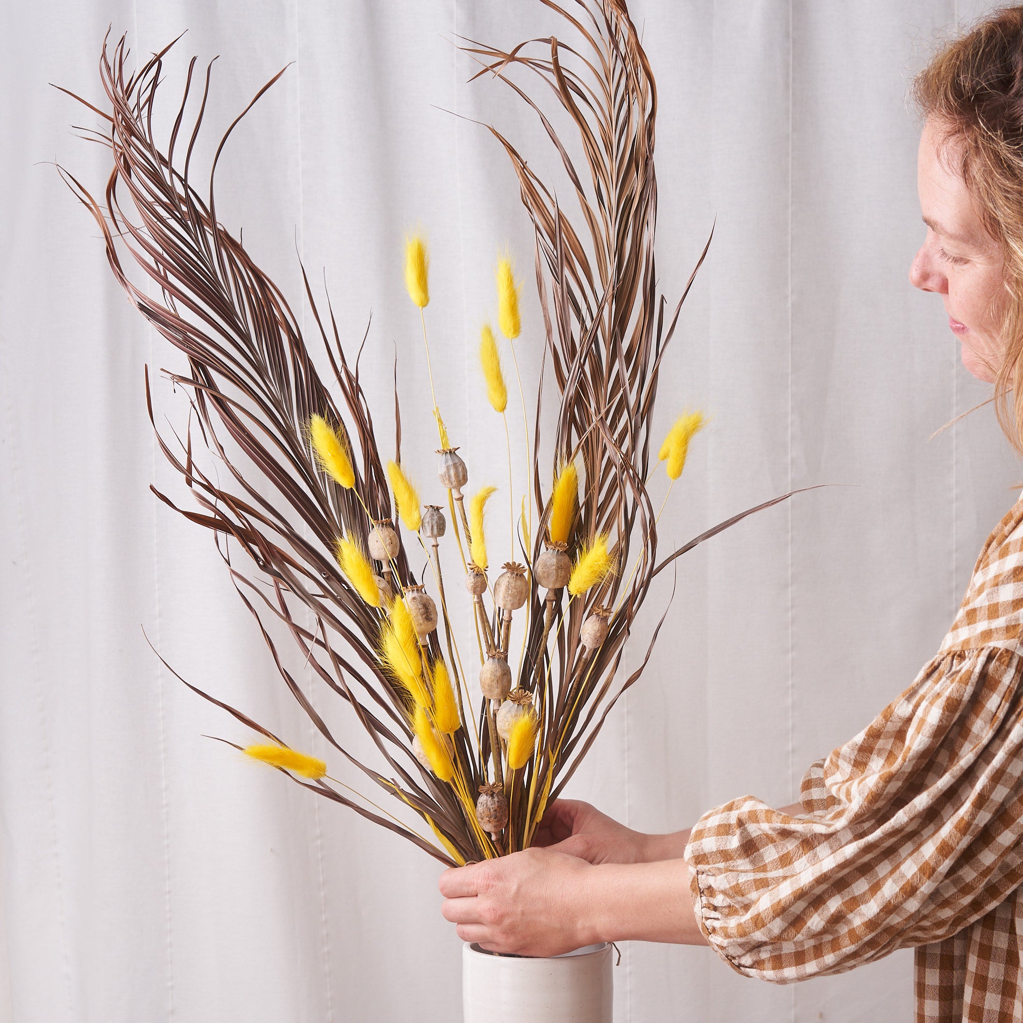 Banana split: Wild kentia, yellow bunnytails and poppy heads