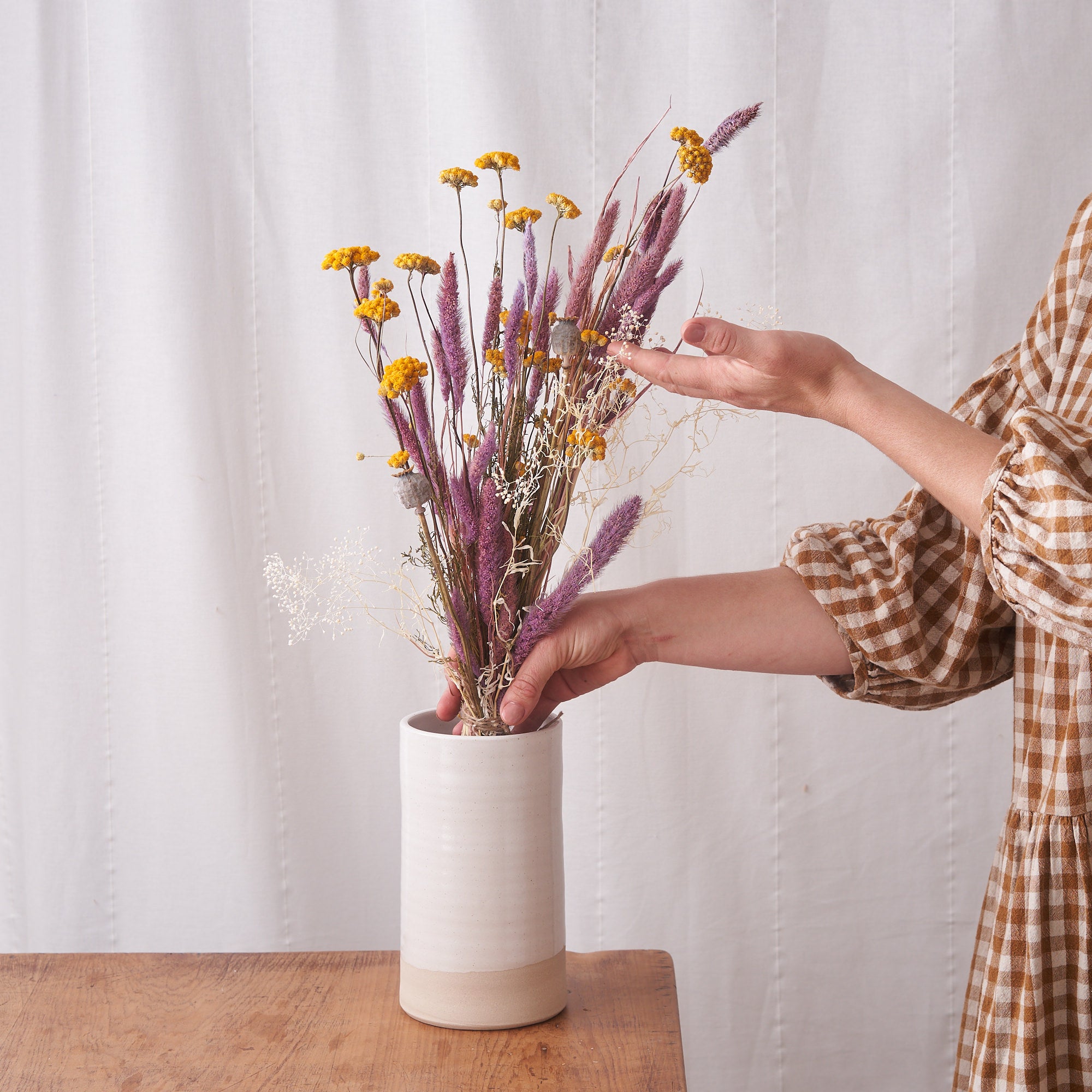 preserved bunch of dried flowers with yellow and pink