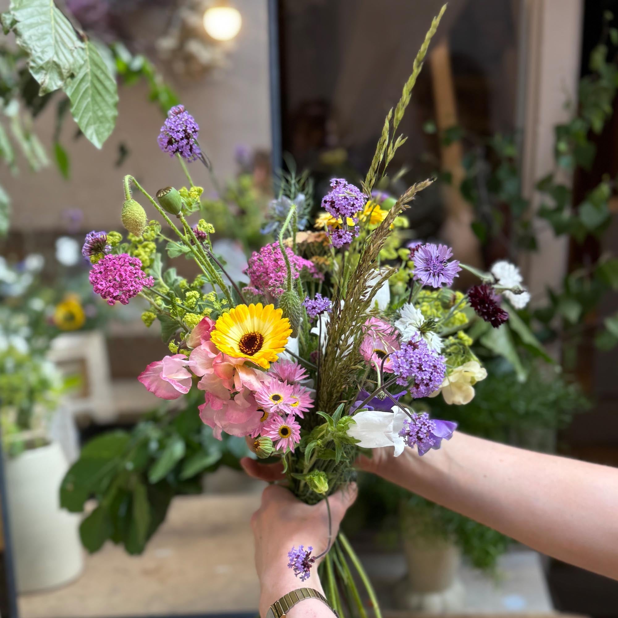 bouquet of british flowers held by florist at botanique london florist