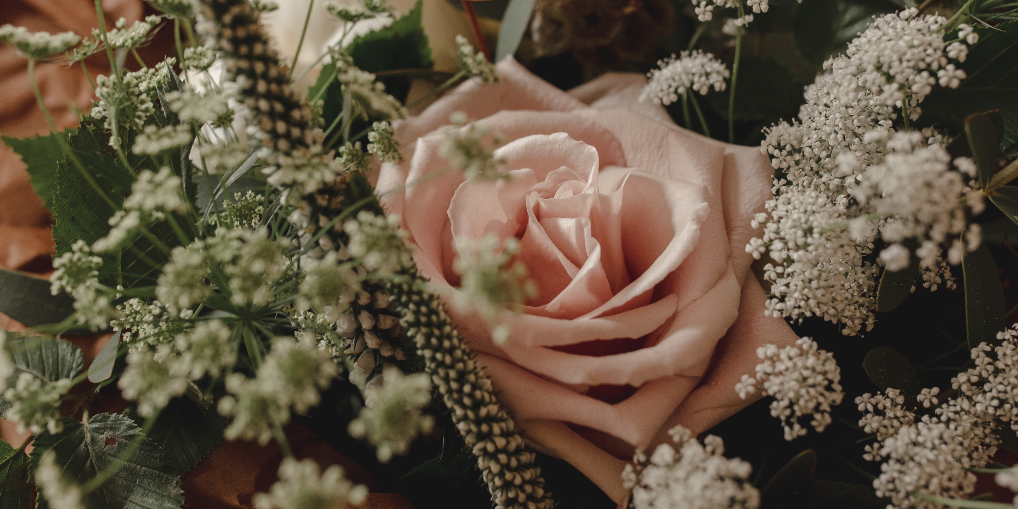 dusty pink roses and seasonal flowers for english countryside garden style bridal bouquet 