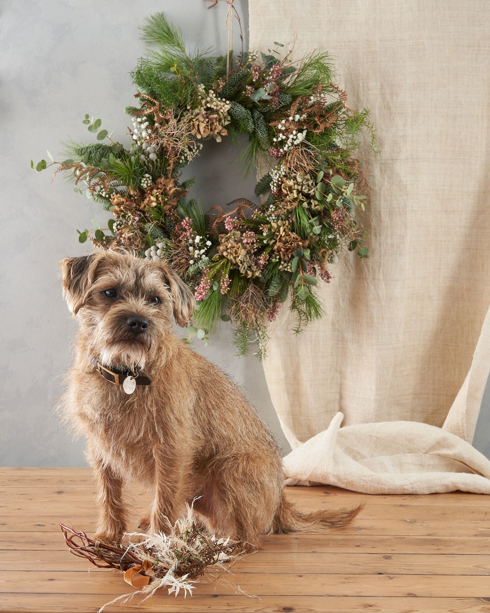 modern and contemporary christmas wreath with dried flowers and grasses