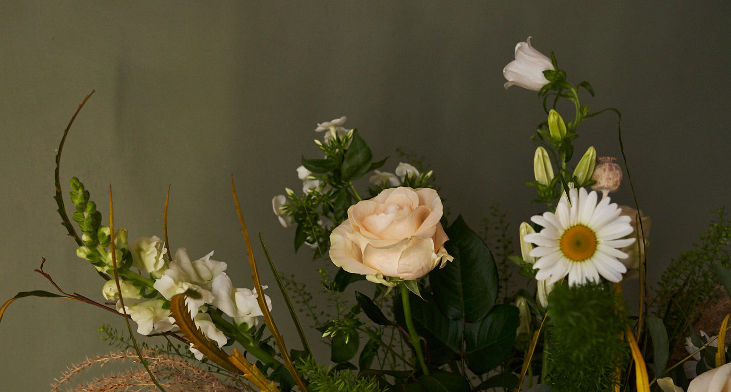 whimsical white bouquet with white roses, eucalyptus, grasses