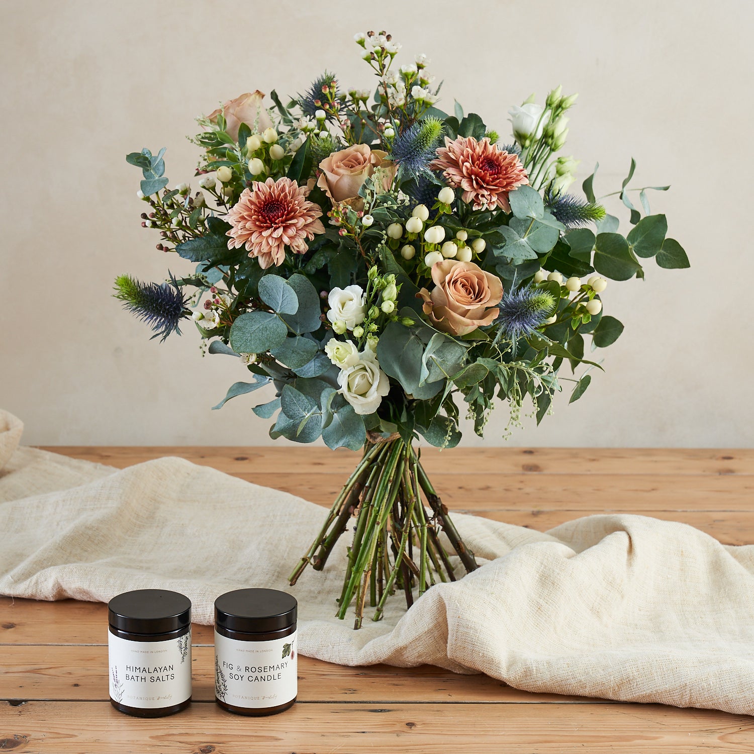 muted tones fresh flower bouquet with eucalyptus roses and thistle