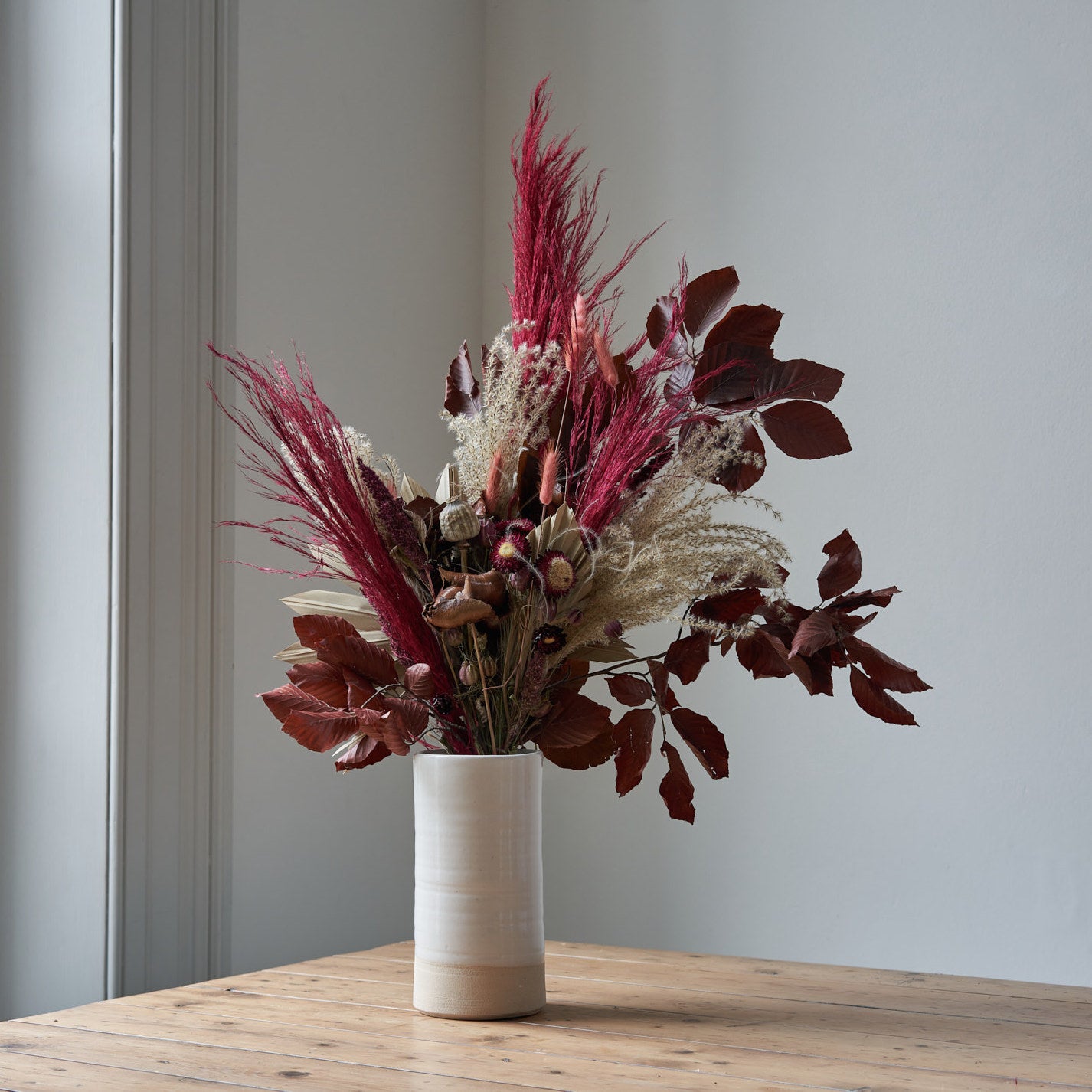 red and purple dried flower bouquet by Botanique Workshop London