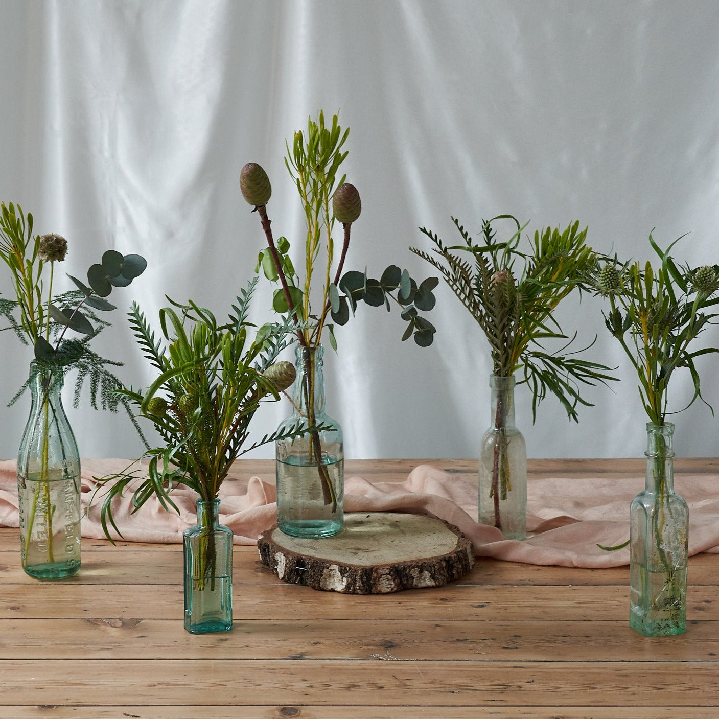 lush woodland bud vase arrangements for weddings and events