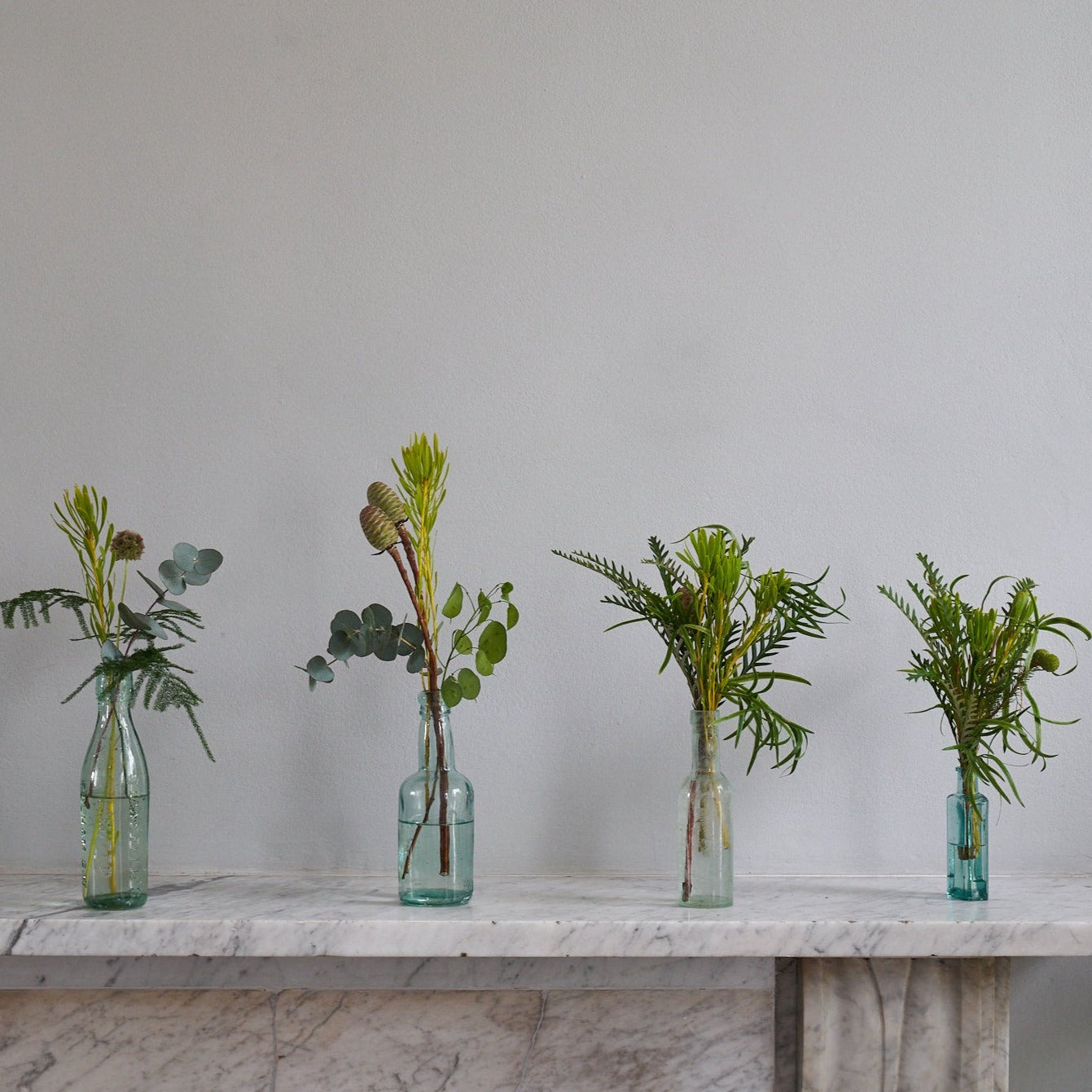 lush woodland bud vase arrangements for weddings and events