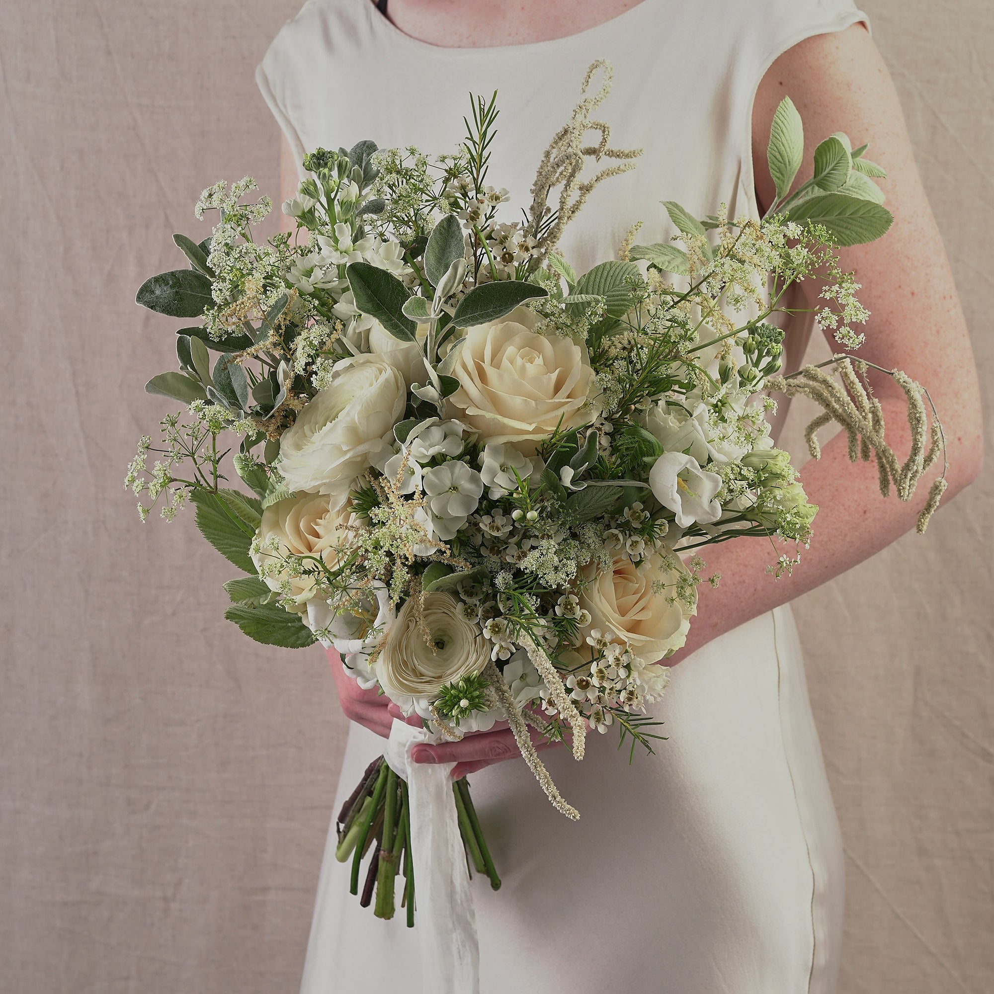 classic white bridesmaids bouquet with white and cream roses by Botanique Workshop