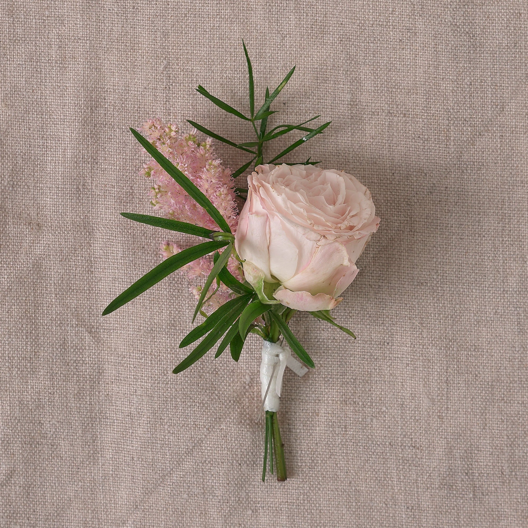 english garden style buttonhole with dusty pink rose