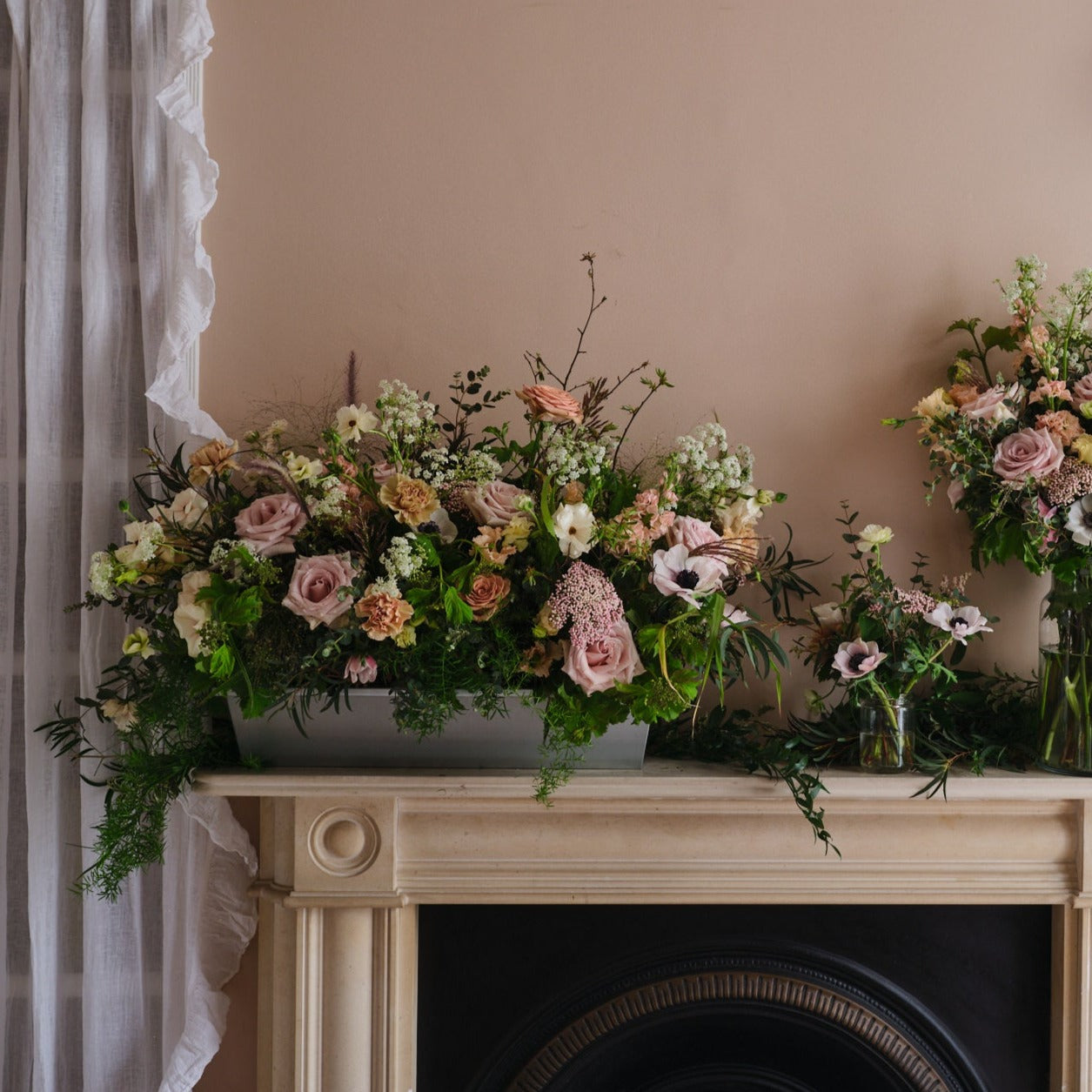 trough arrangements with english country garden style dusty pink flowers for weddings