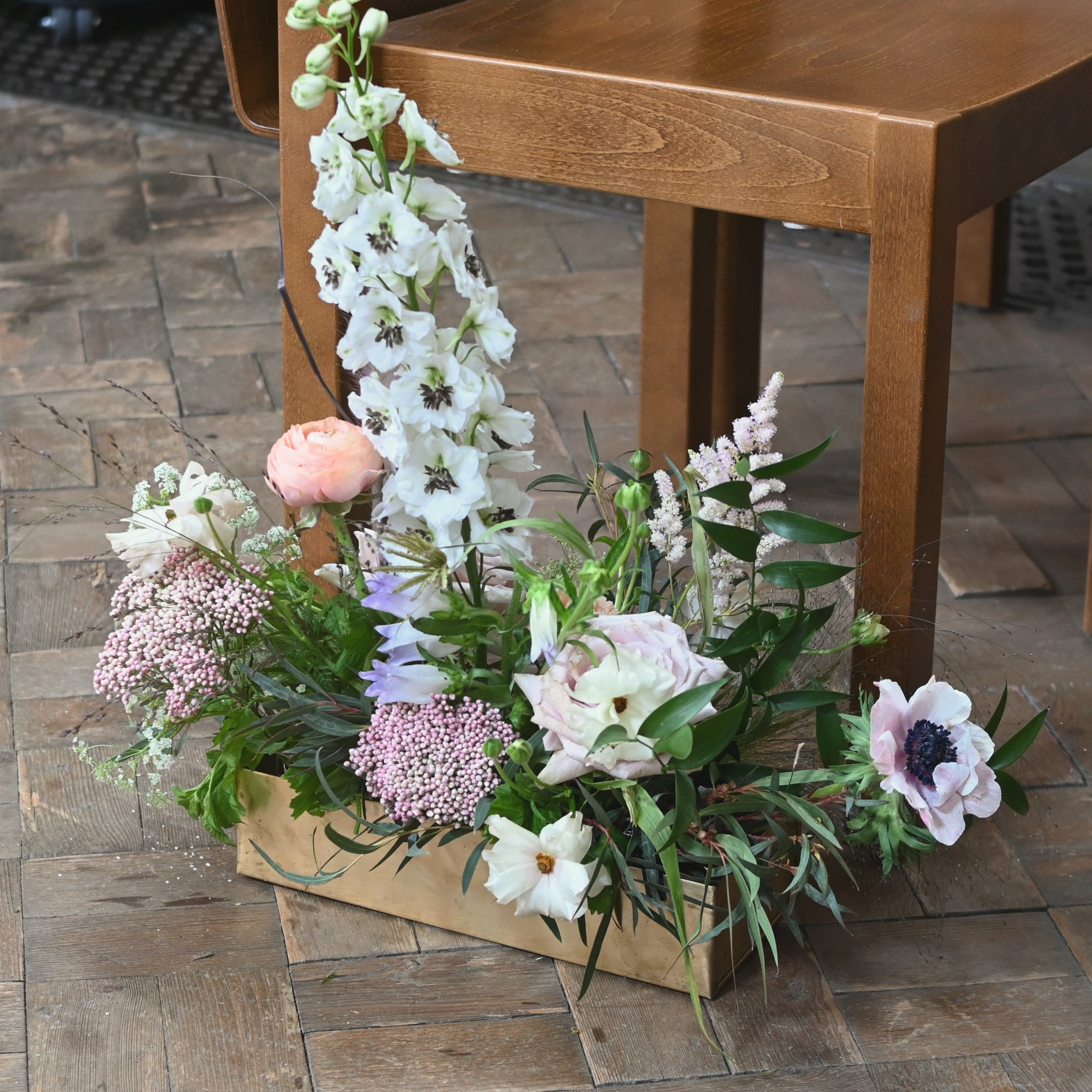 english country garden style trough arrangement for weddings and events