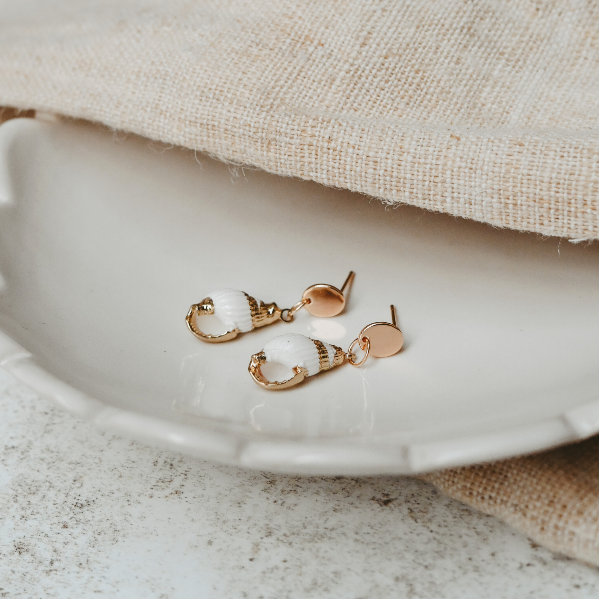 Cosmos Studio by Botanique Workshop natural and golden shell earrings