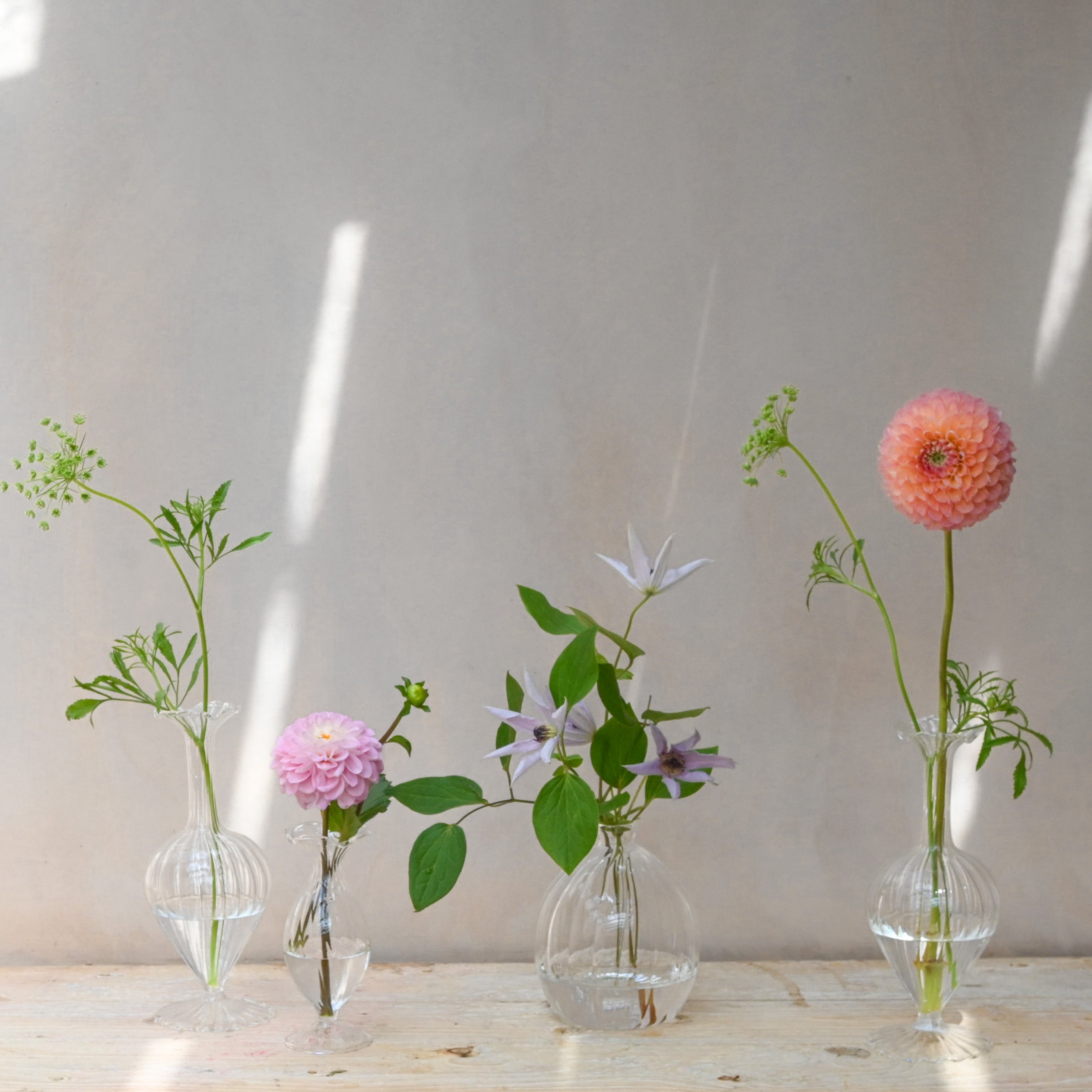 glass bud vases with flowers