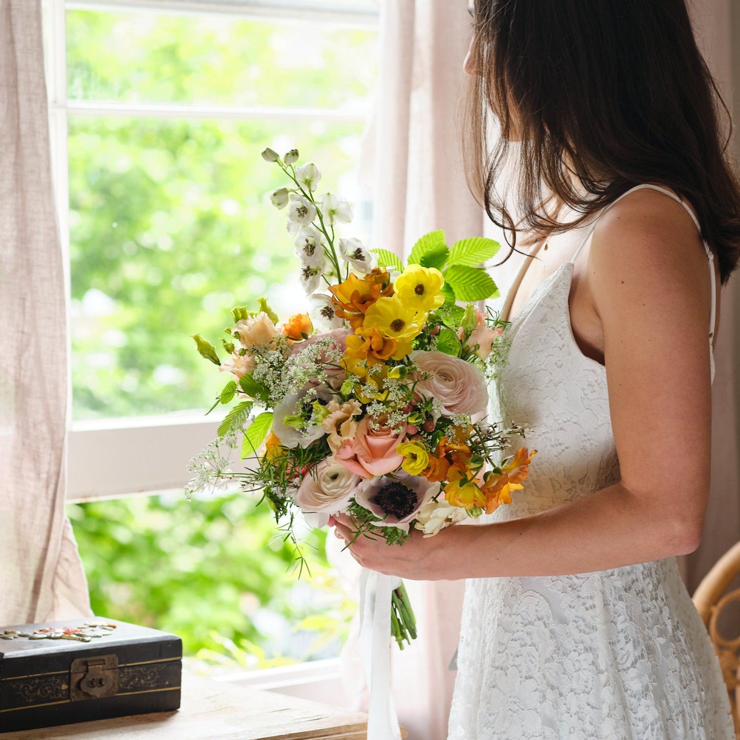 vibrant summery and colourful bridal bouquet with yellow green white and coral flowers by Botanique Workshop London