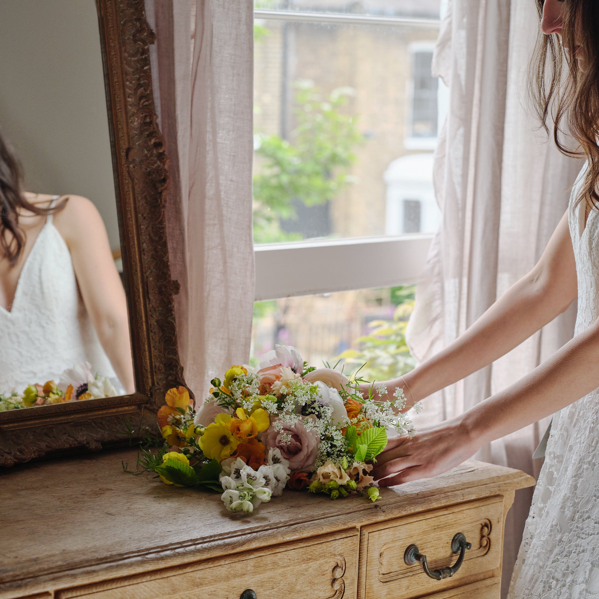 vibrant summery and colourful bridal bouquet with yellow green white and coral flowers by Botanique Workshop London