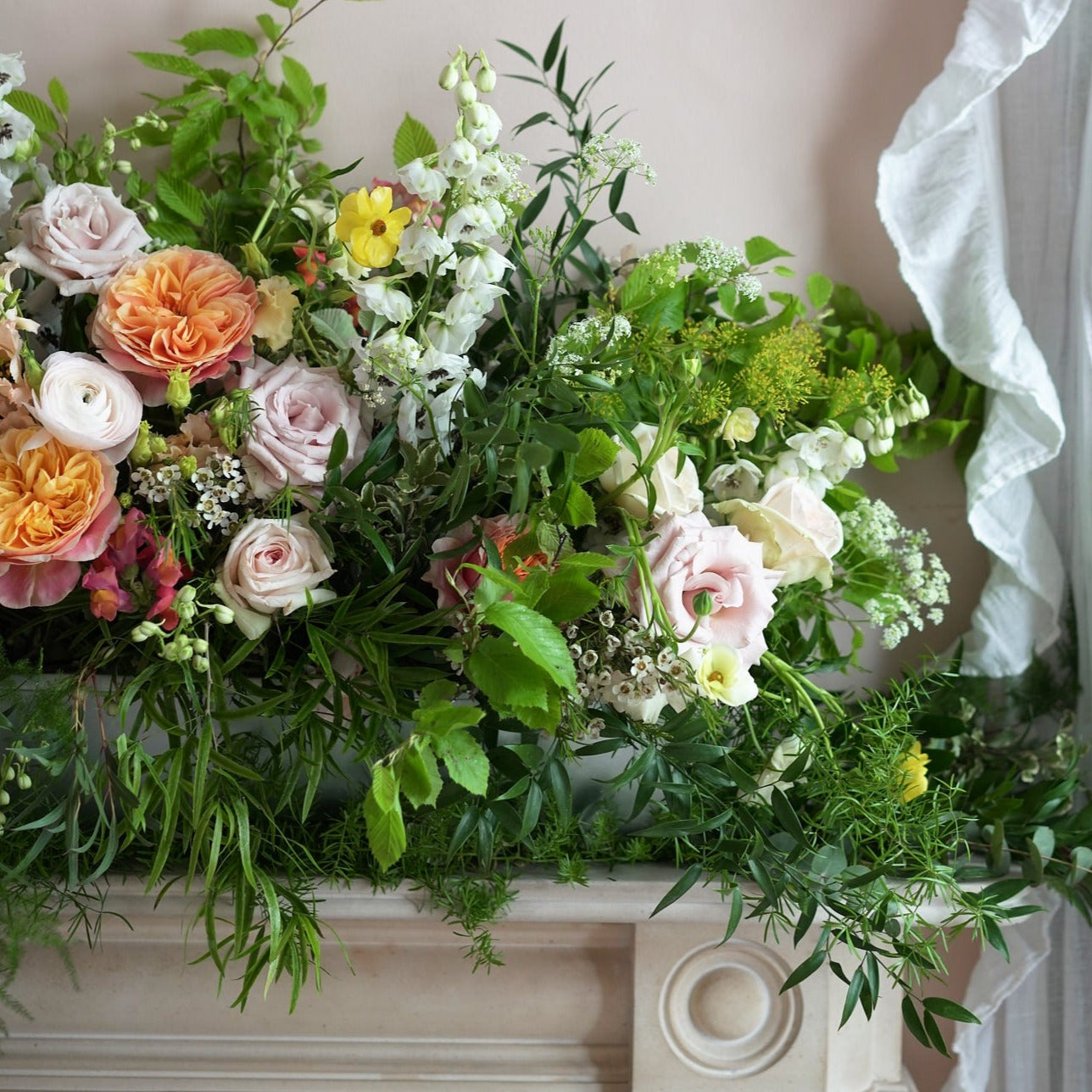 colourful and vibrant trough arrangement to dress up wedding venues and mantlepieces
