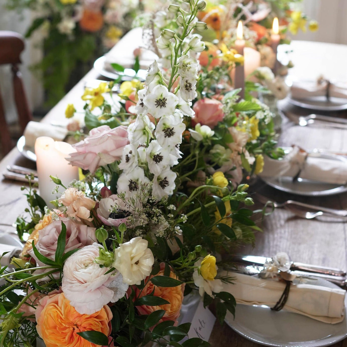 colourful and vibrant trough arrangement to dress up wedding venues and mantlepieces