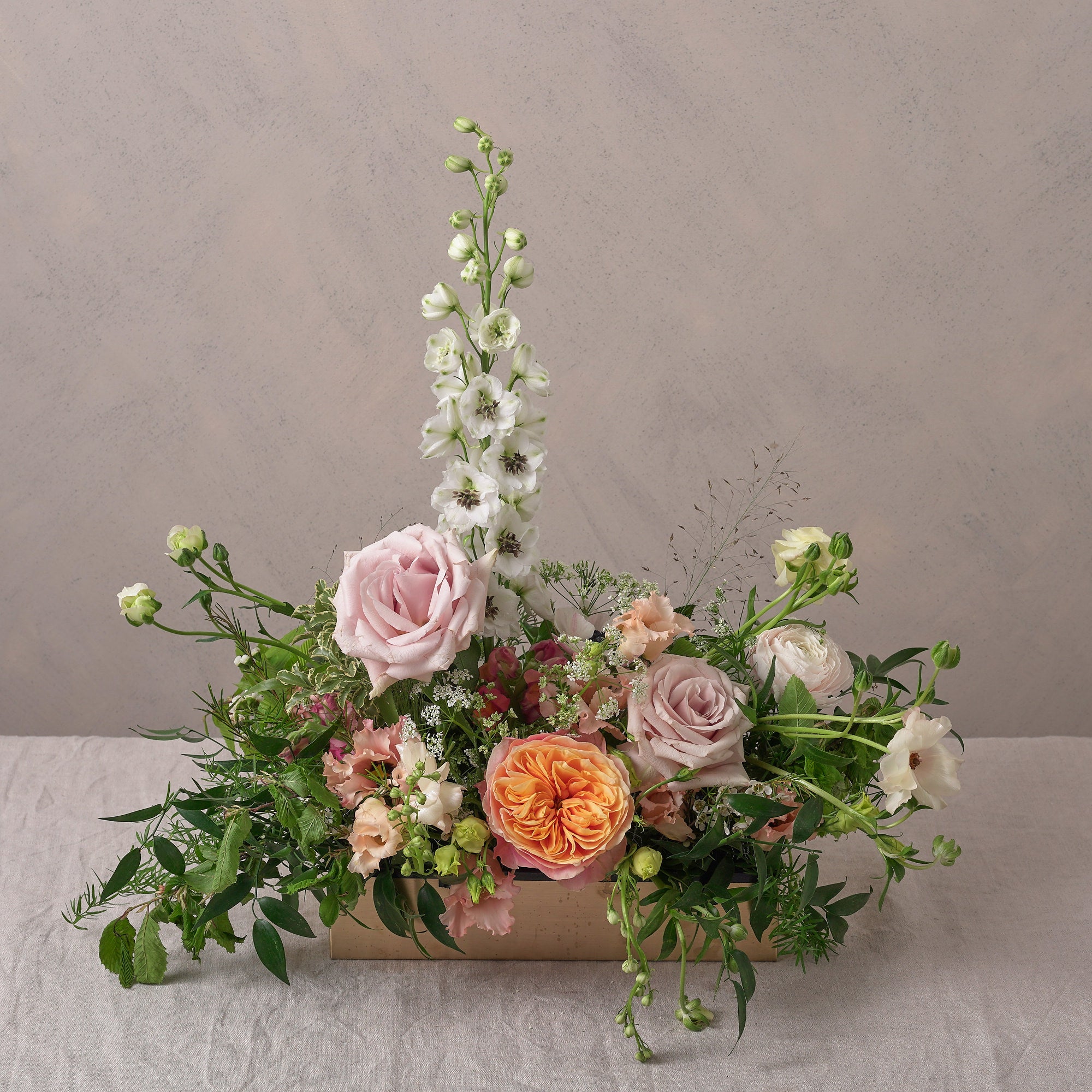 midsummer bloom trough arrangement with vibrant and fresh flowers for weddings and events