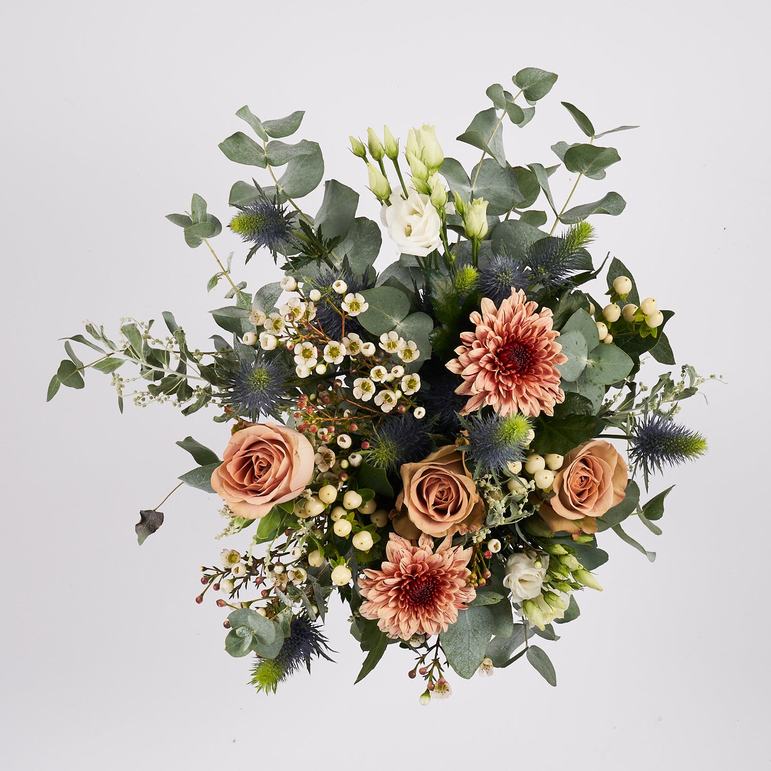 muted tones fresh flower bouquet with eucalyptus roses and thistle