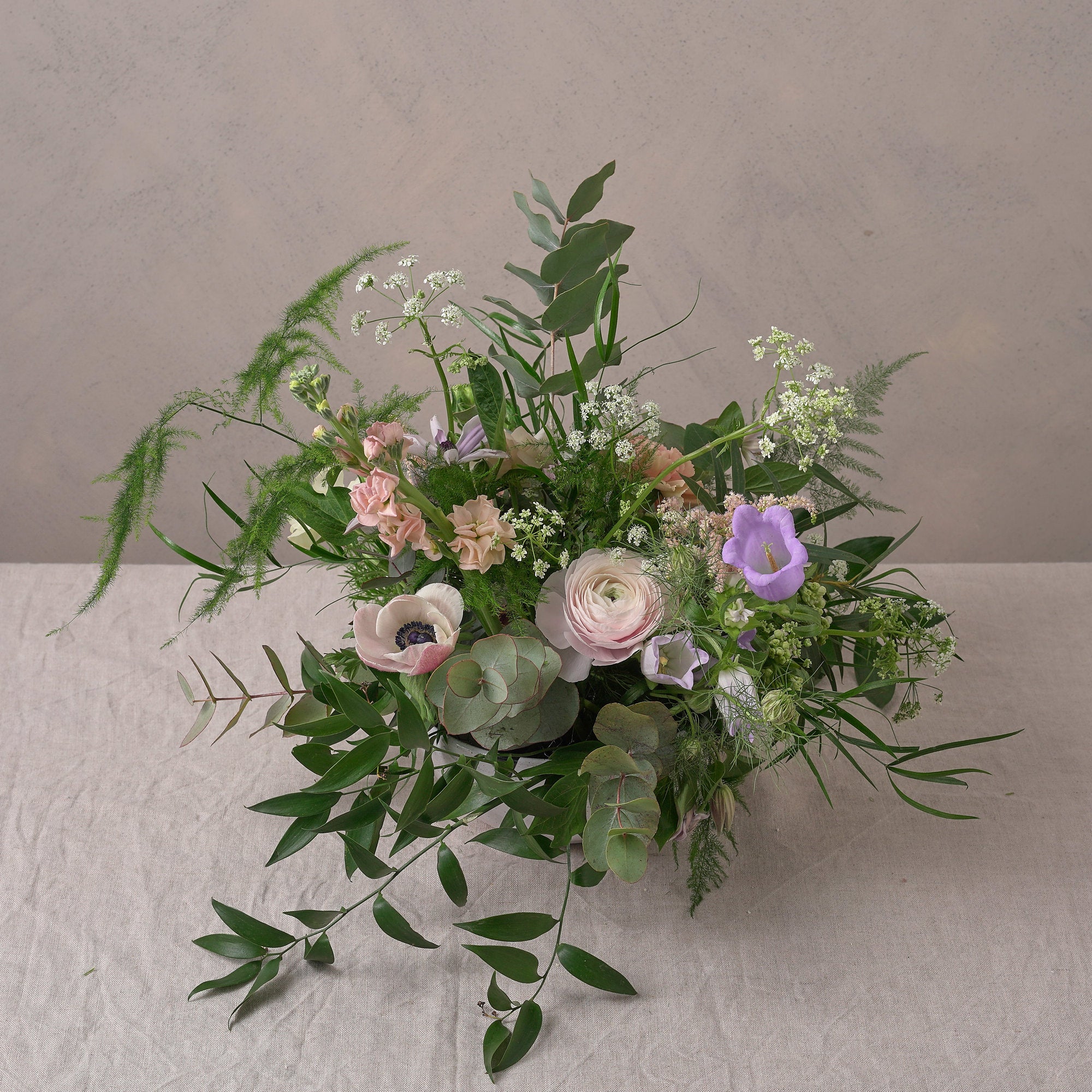 pastel wildflower bowl arrangement to decorate wedding venue and dining table