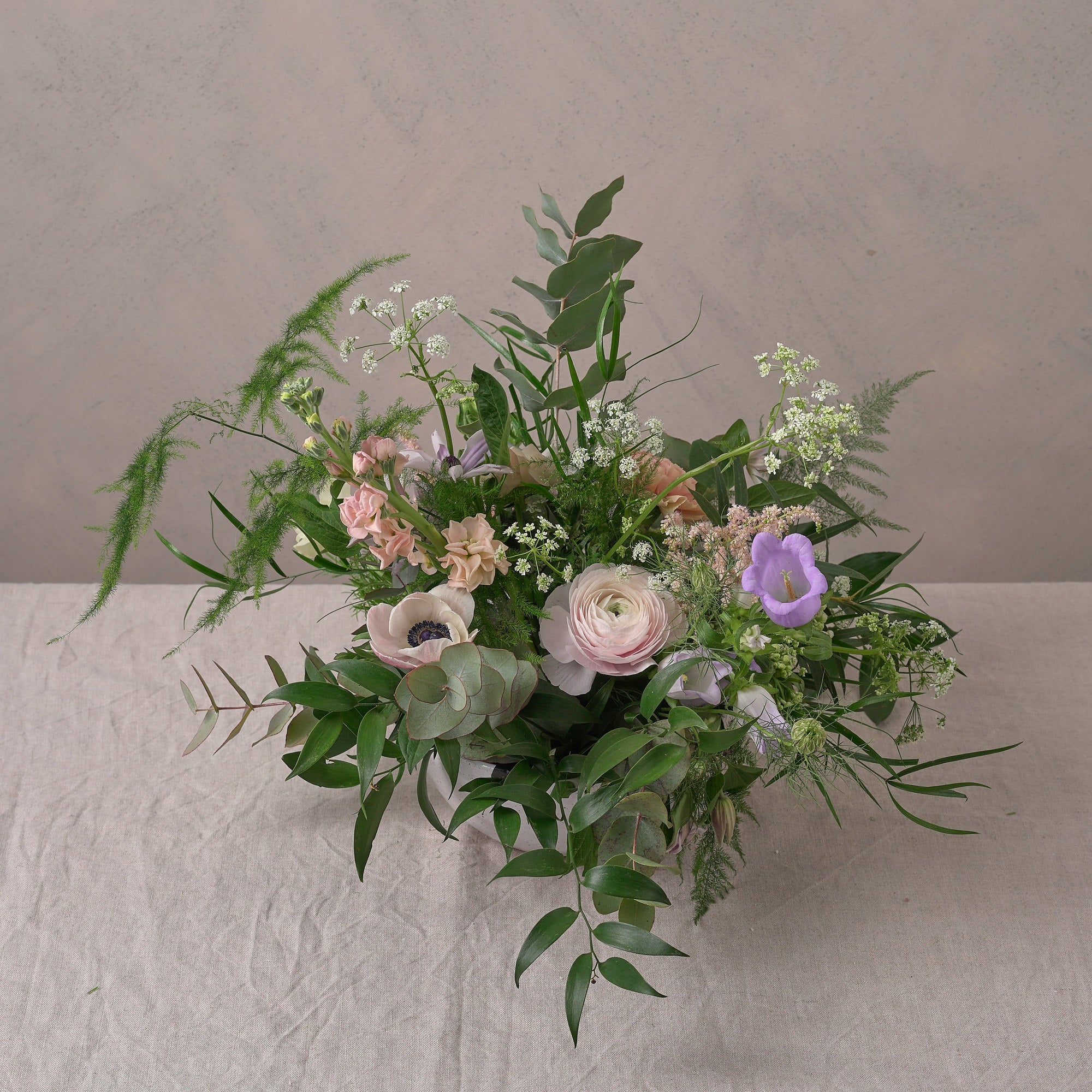 pastel wildflower bowl arrangement to decorate wedding venue and dining table