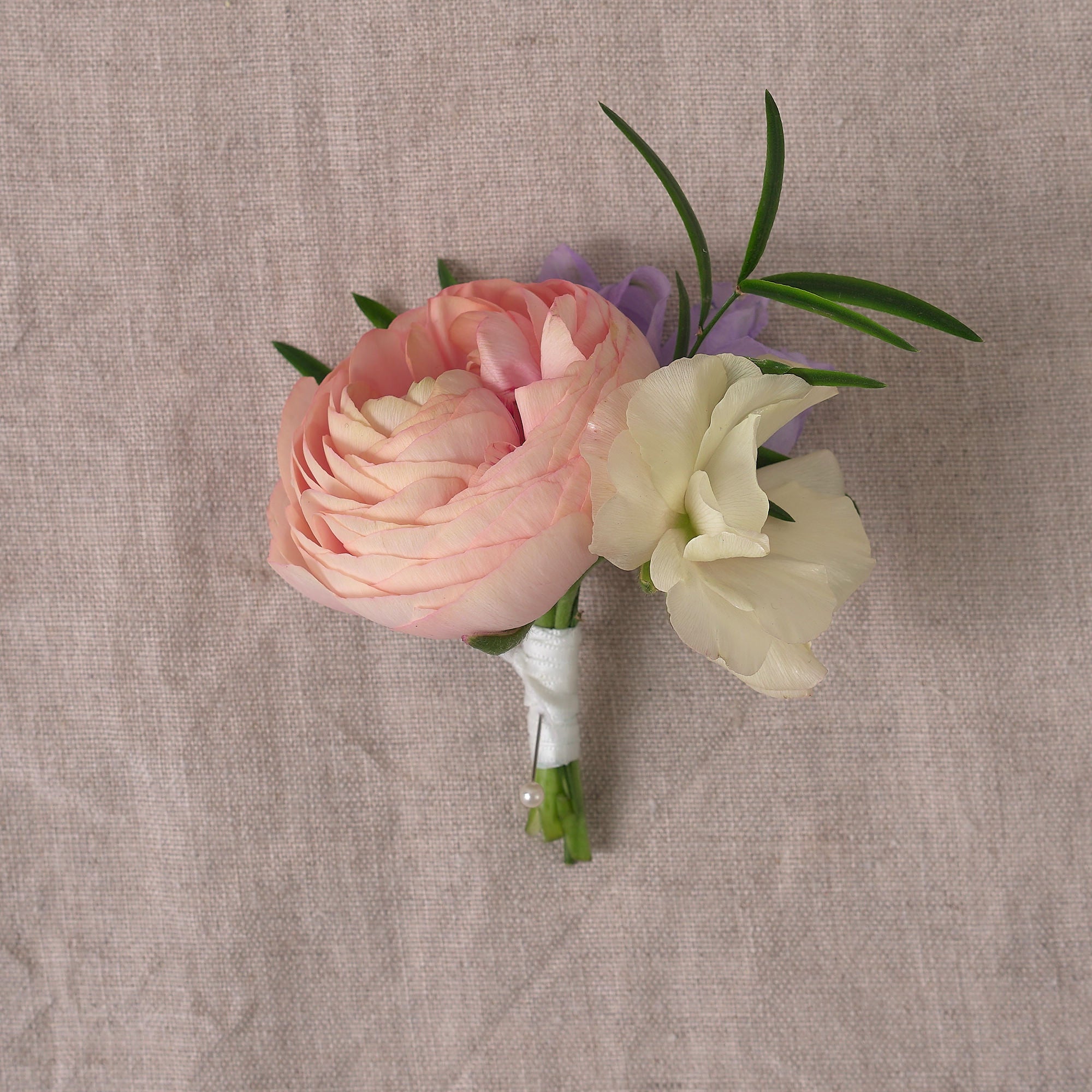 pastel wildflower buttonhole and corsage for grooms and brides