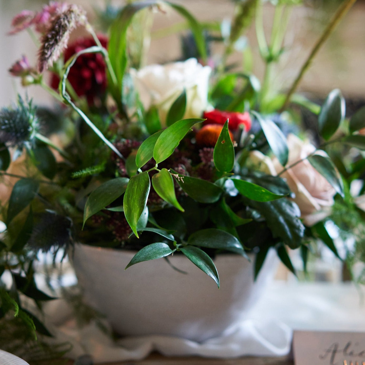 rustic burgundy cream and green wedding flowers in bowl arrangements