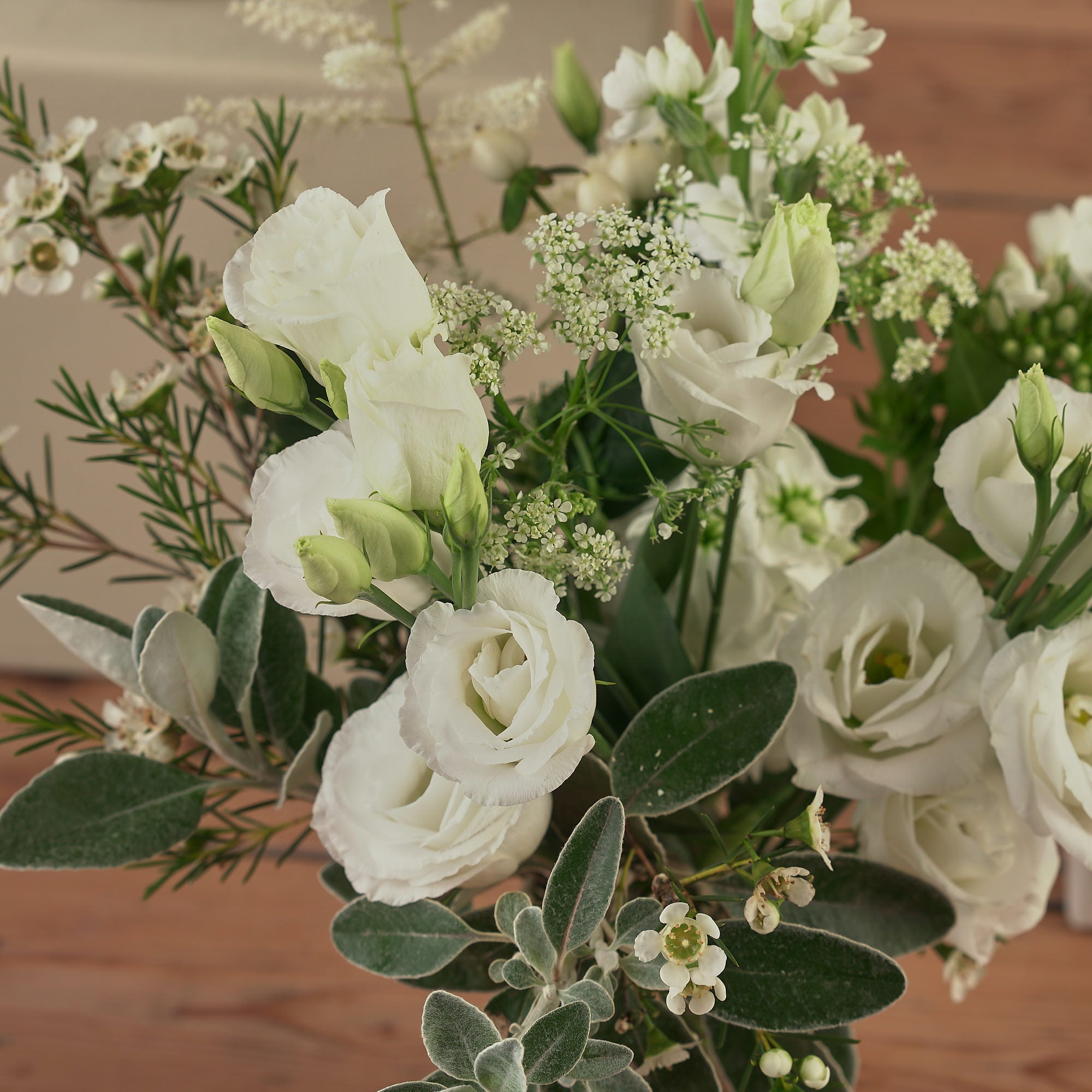 classic white table arrangements for weddings and events by Botanique Workshop London