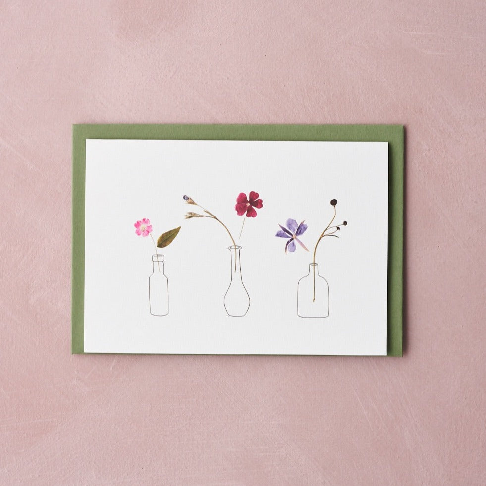 pressed flowers design in vases greetings card