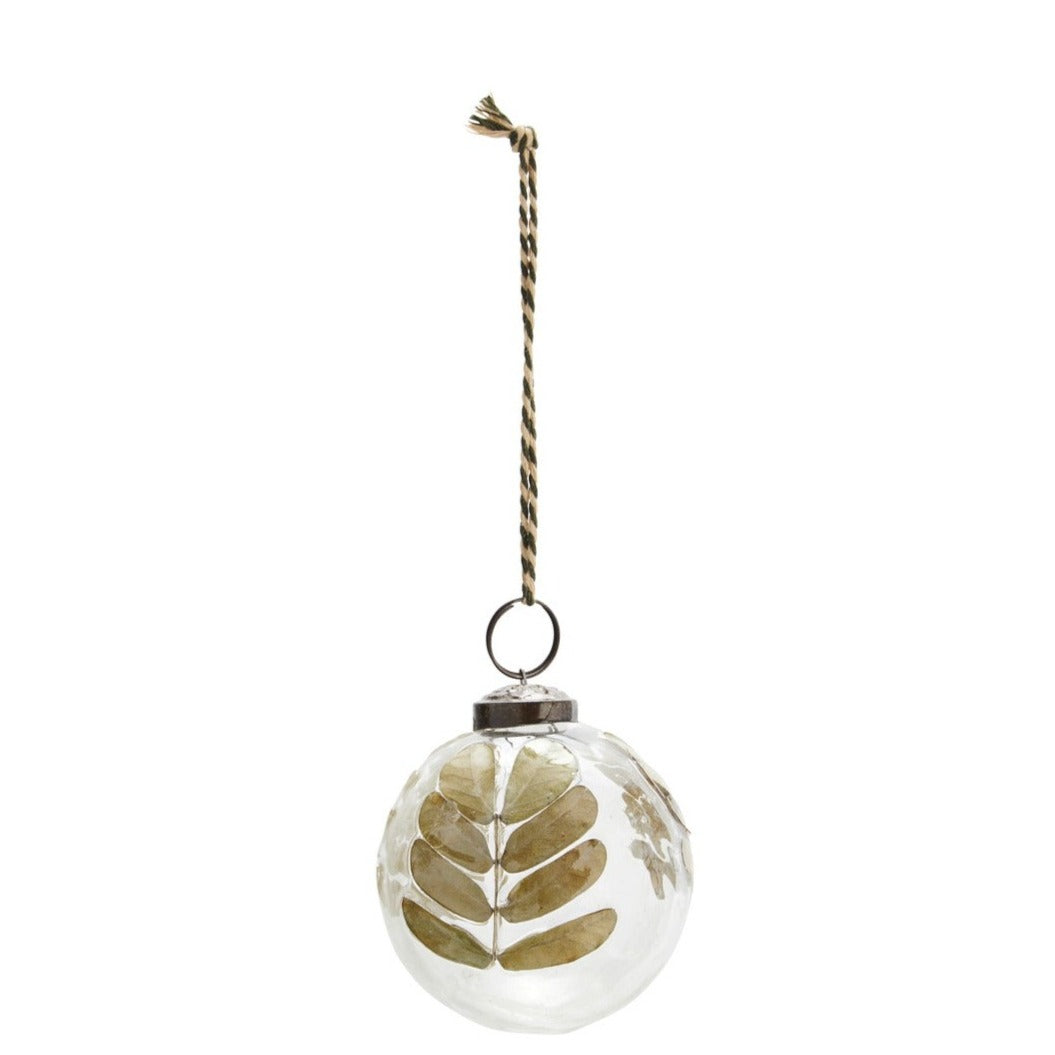 christmas bauble with real leaves inside