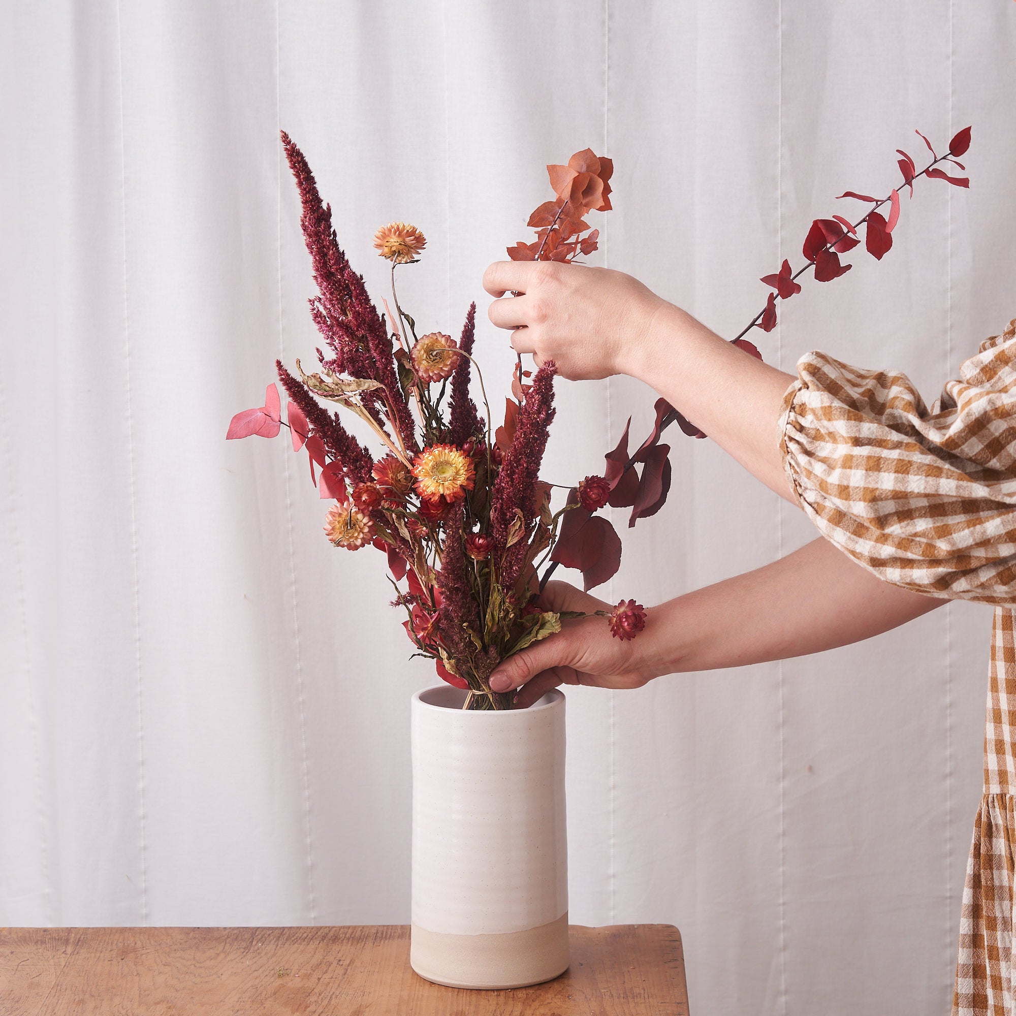 dried flowers bunch with coral straw flowers and amaranthus