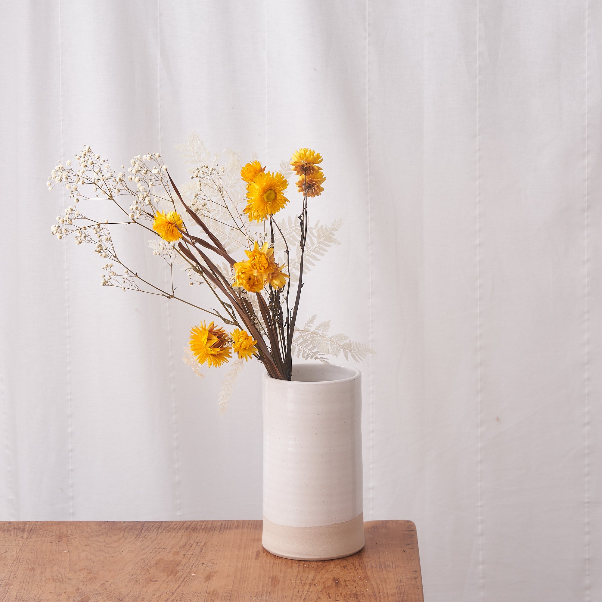 Sun Beam: bleached fern, white gyp and yellow straw flower
